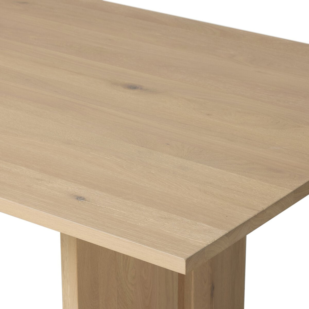 Four Hands Emerald Dining Table in bleached Romanian oak with splice leg detail, close-up detail of oak grain, view 2