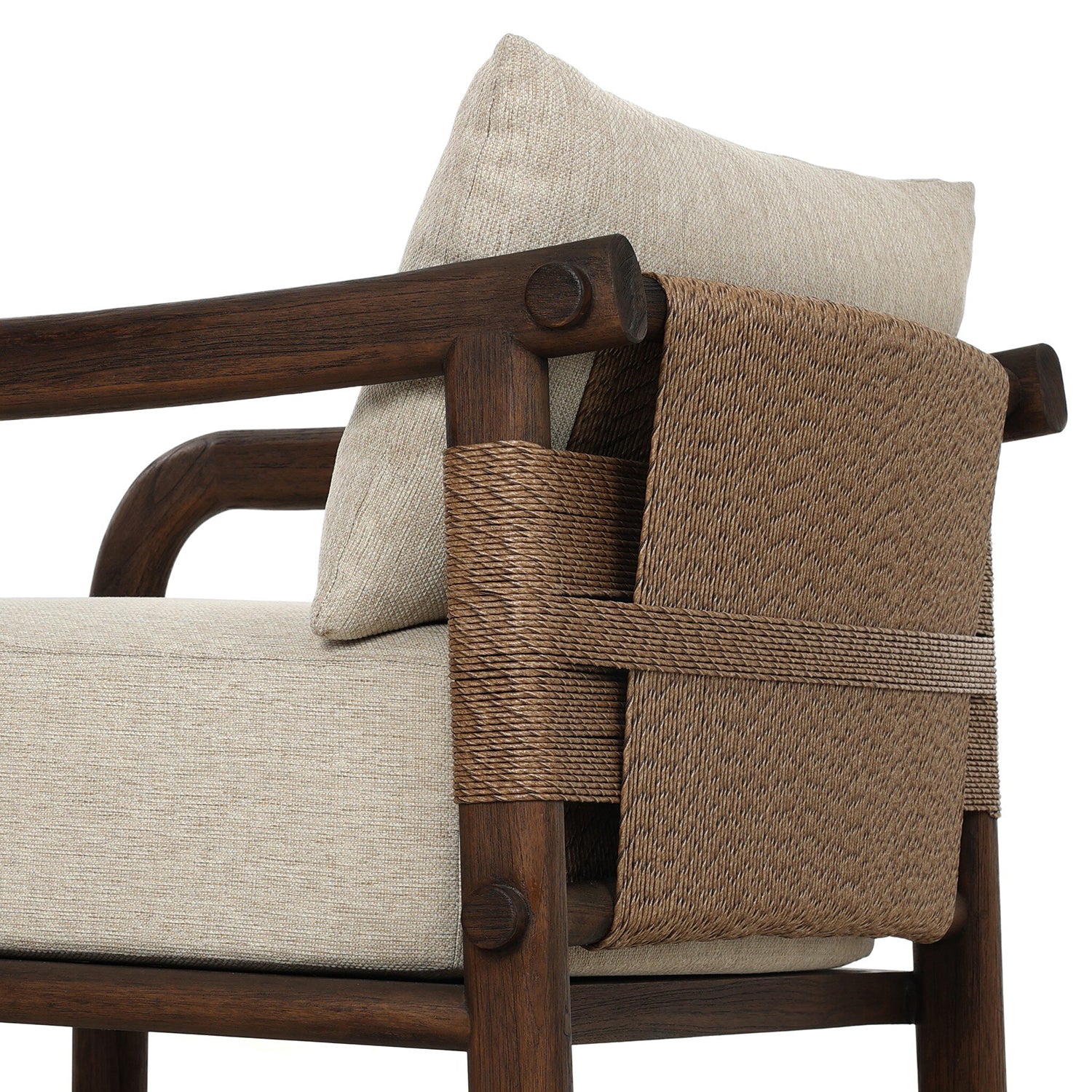 Four Hands Boda Outdoor Chair in teak with faux hyacinth weave and beige cushion, close-up detail, view 1