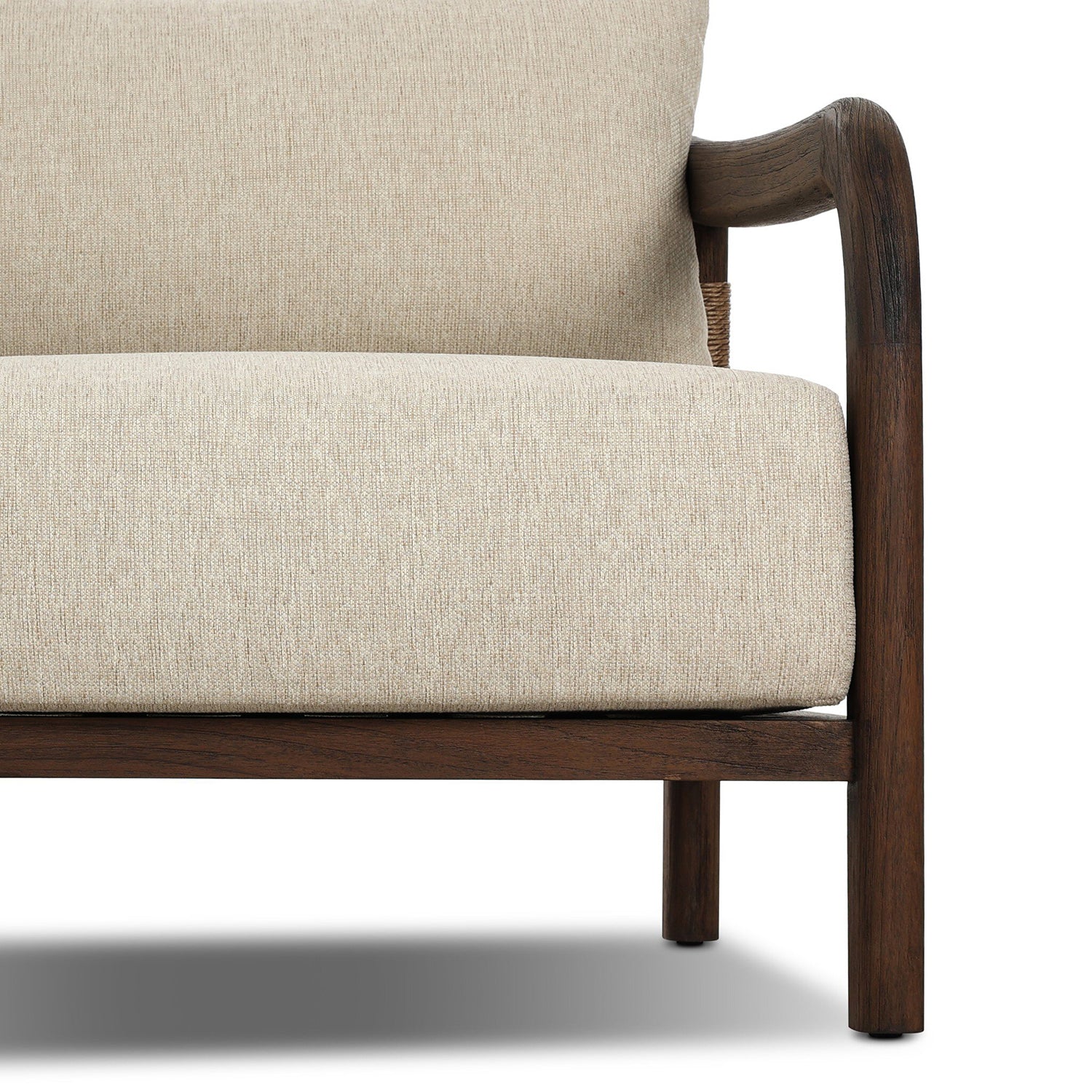 Four Hands Boda Outdoor Chair in teak with faux hyacinth weave and beige cushion, close-up detail, view 6