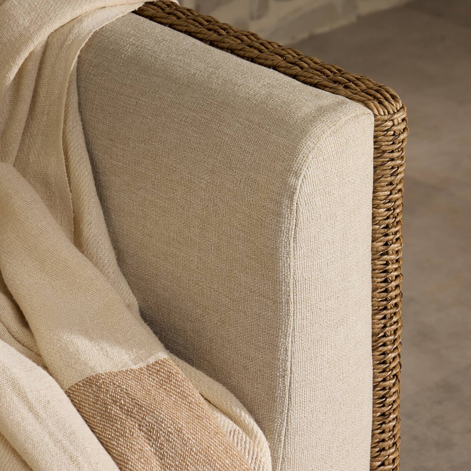 Four Hands Cabot Outdoor Chair in woven teak with buff cushions, close-up detail of woven frame and cushion, view 7