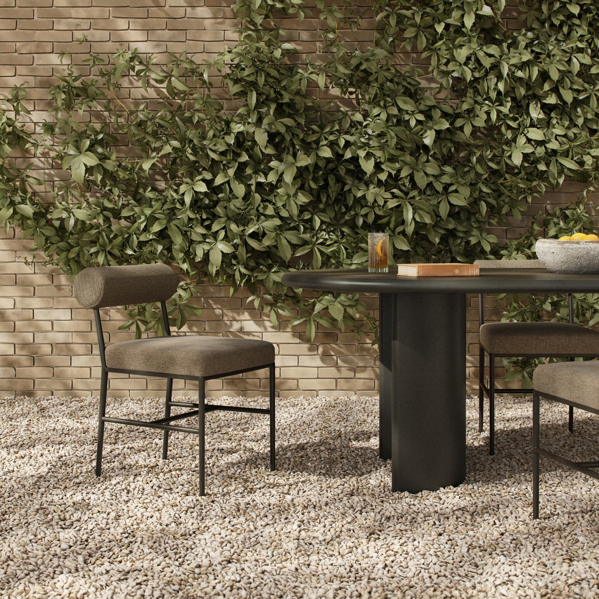 Four Hands Brookline Alessi Fawn Outdoor Dining Chair in a styled room setting