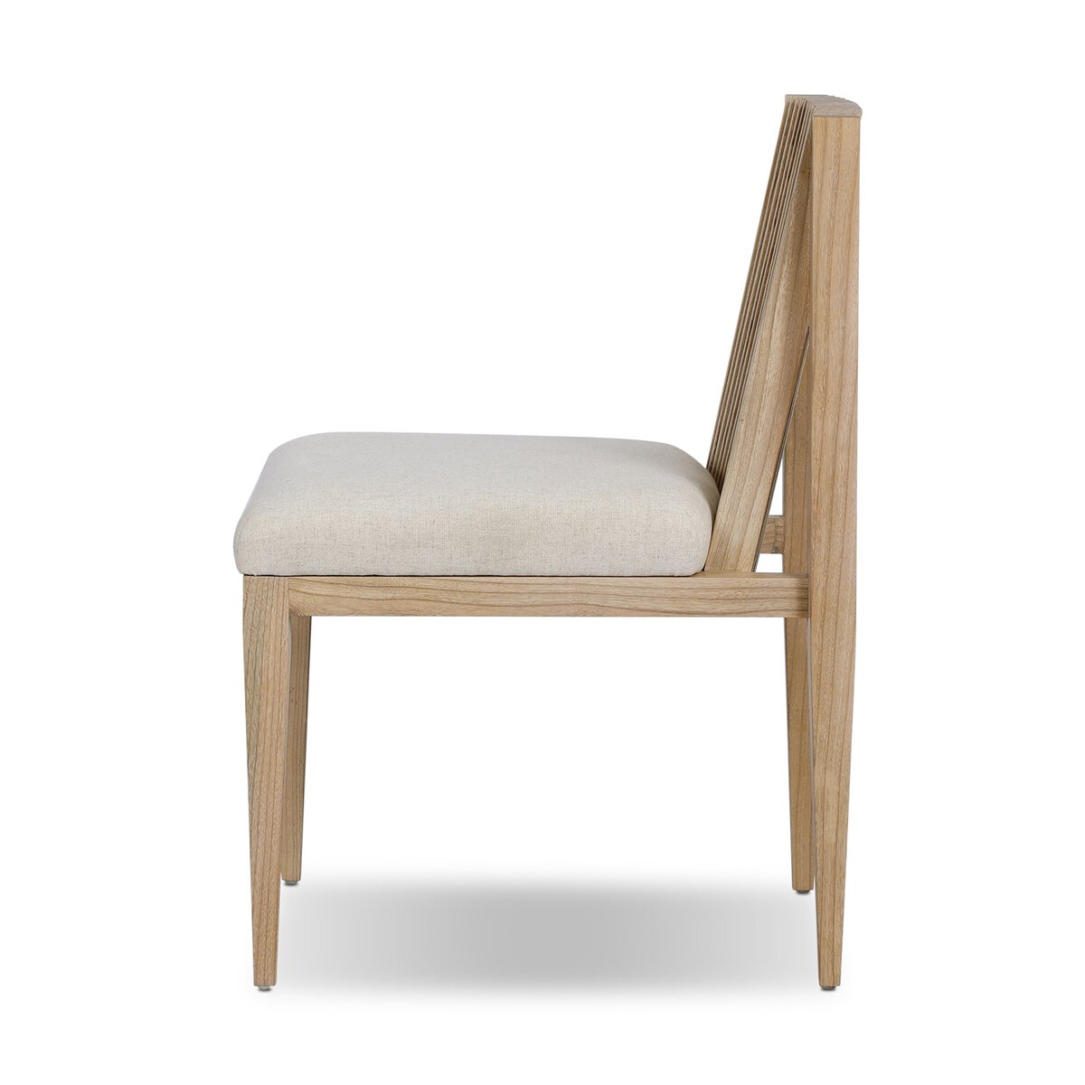 Four Hands Cavallo Dining Chair Set of 2 in sand linen with slatted sungkai back, side profile view