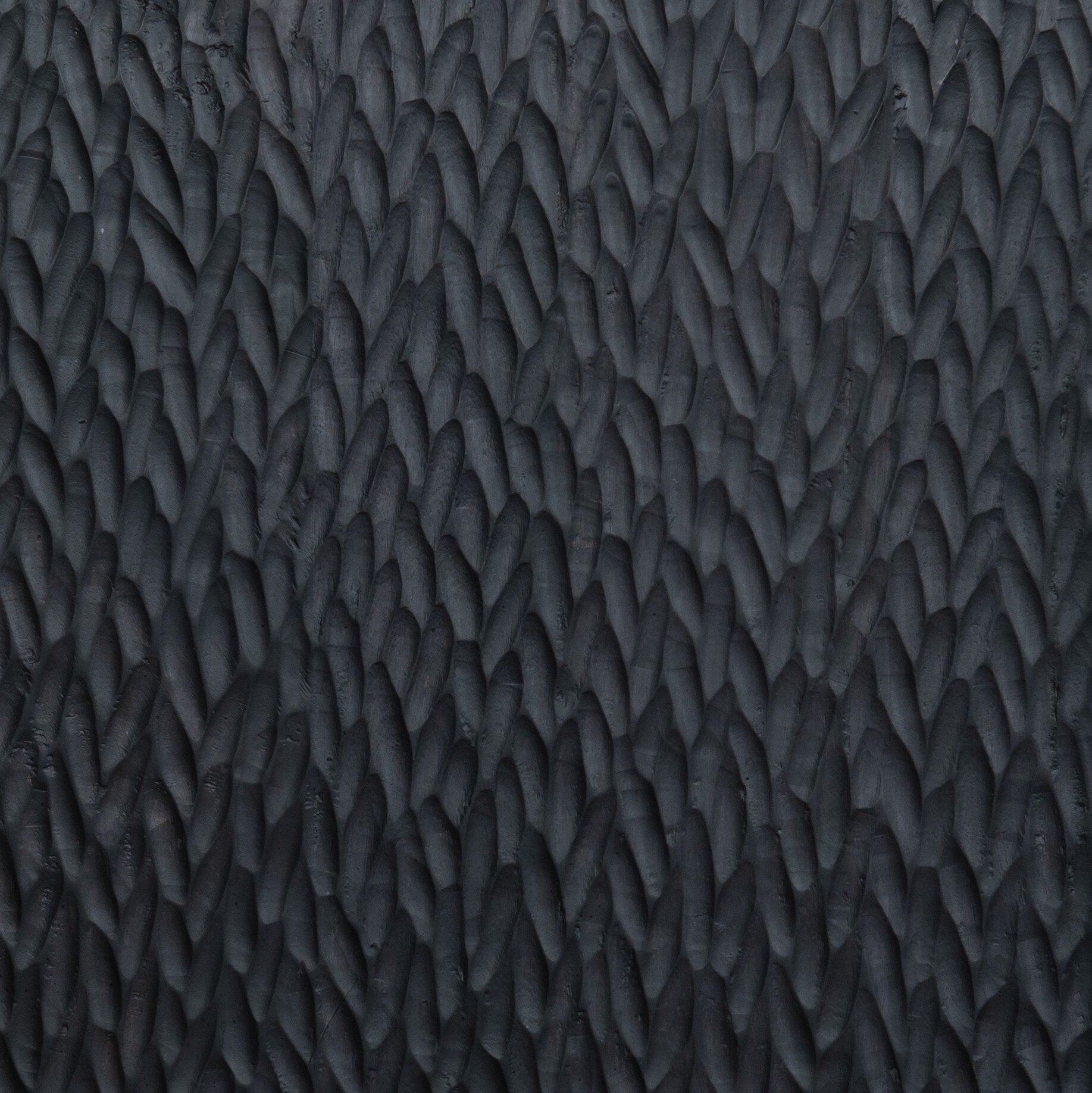 Four Hands Shevall Sideboard in carved black mango with cylinder legs, close-up detail of carved door front, view 5