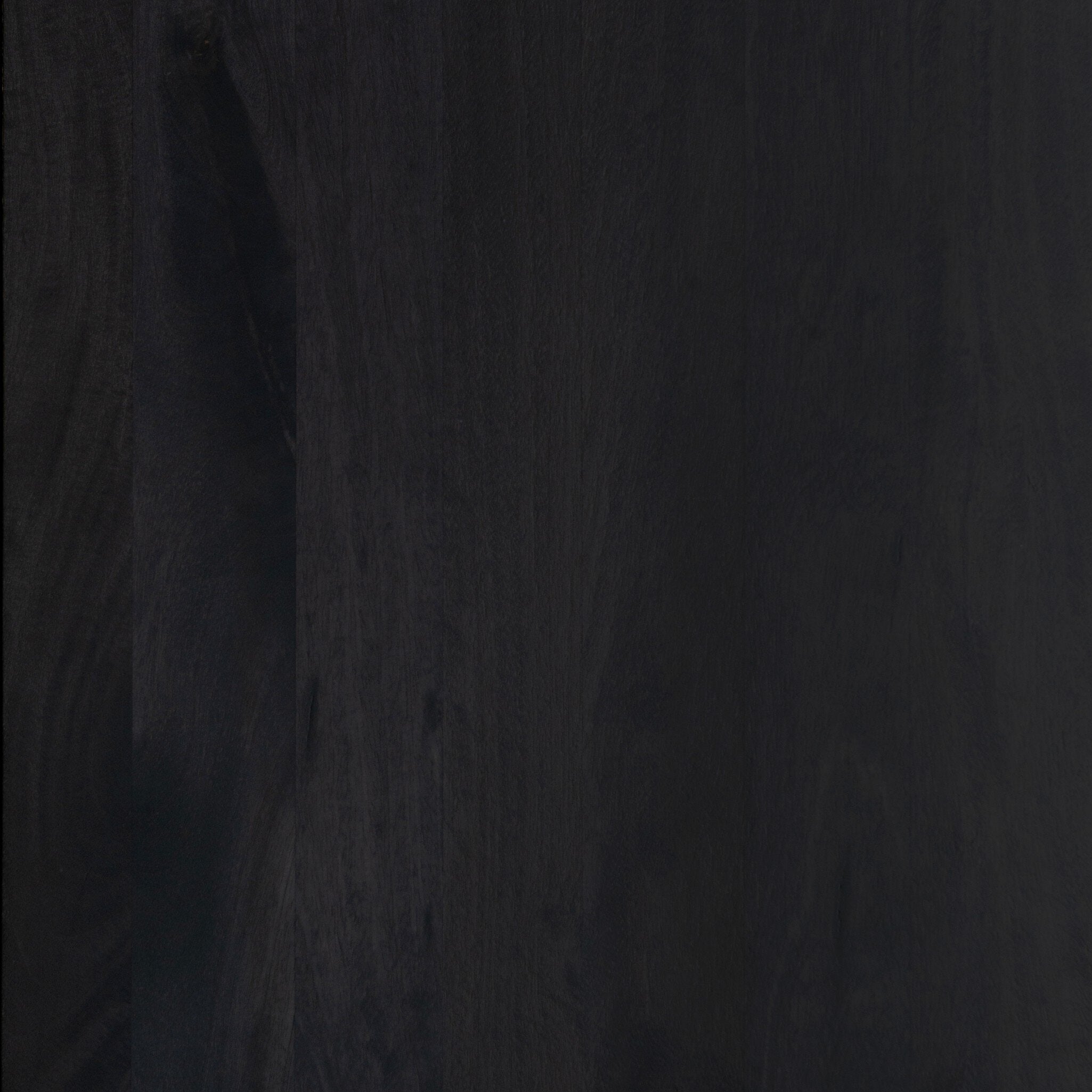 Four Hands Shevall Sideboard in carved black mango with cylinder legs, close-up detail of carved door front, view 6