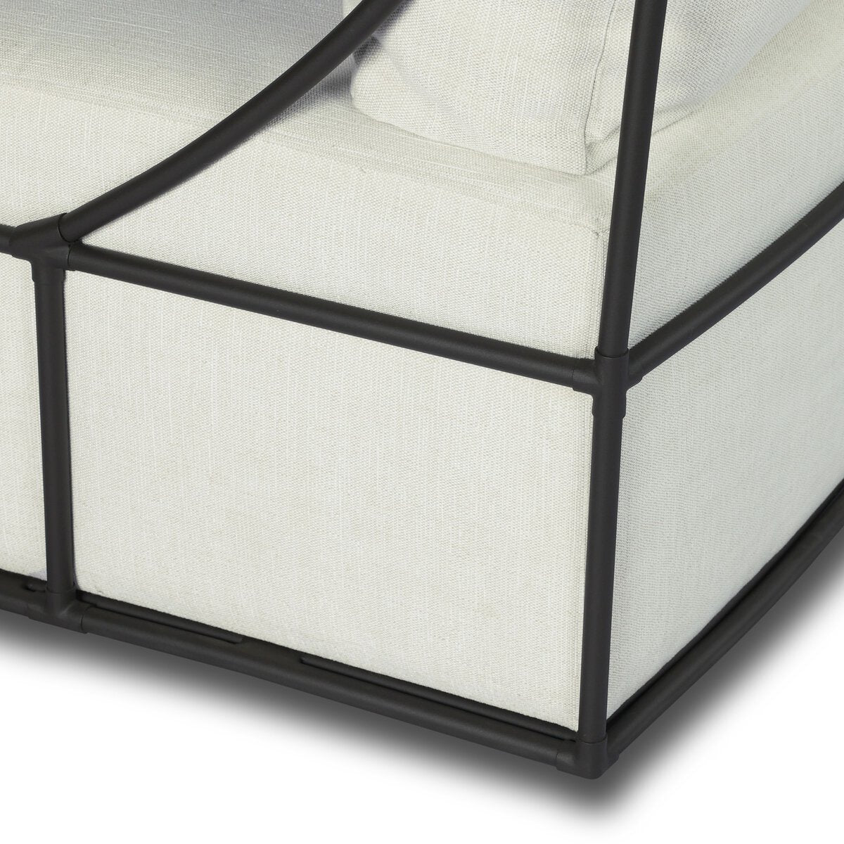 Four Hands Enola Outdoor Swivel Chair in bronze iron cross-hatch with cream cushion, close-up detail of ironwork, view 4