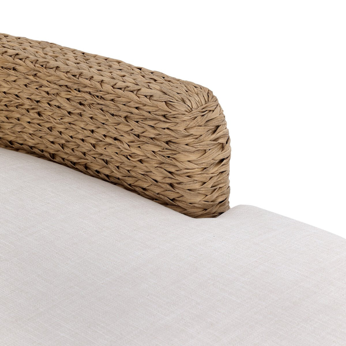 Four Hands Caney Outdoor Double Chaise in coastal weave with cream cushion, close-up detail, view 4