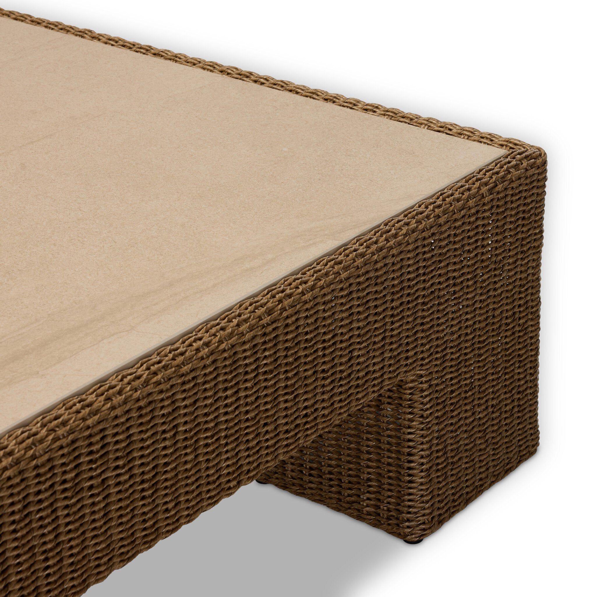 Four Hands Maris Outdoor Coffee Table in faux dark hyacinth with sintered stone top, close-up detail of hyacinth weave, view 3