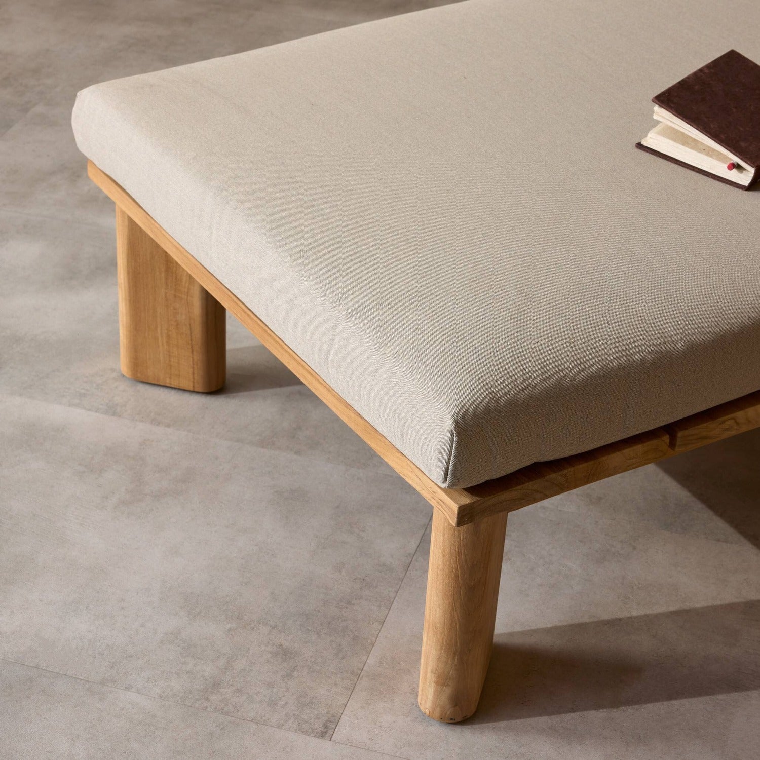 Four Hands Sterling Ibiza Mole Outdoor Chaise in golden teak with mocha acrylic cushion, alternate styled view, view 2