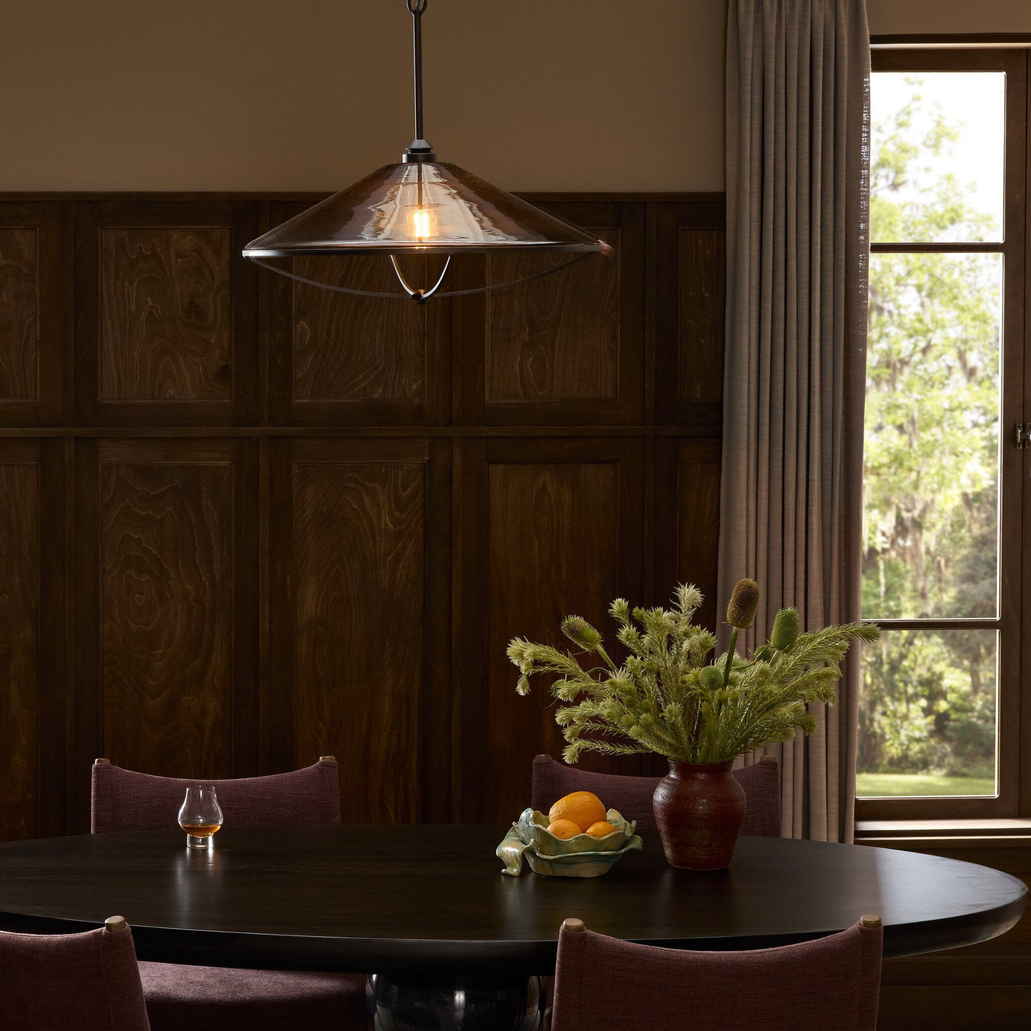 Four Hands Lucine Amber Glass Pendant - styled room setting