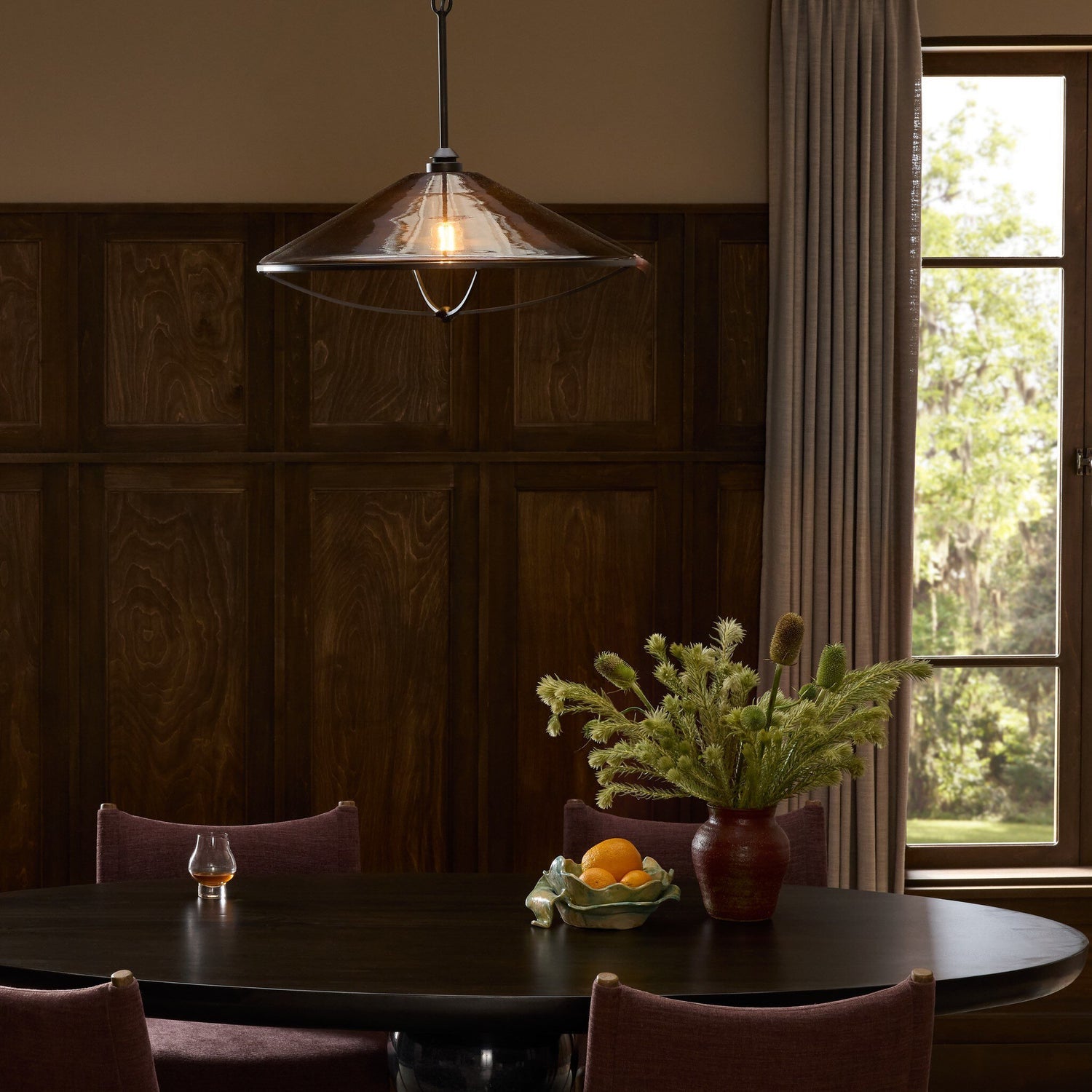 Four Hands Lucine Amber Glass Pendant - styled room setting