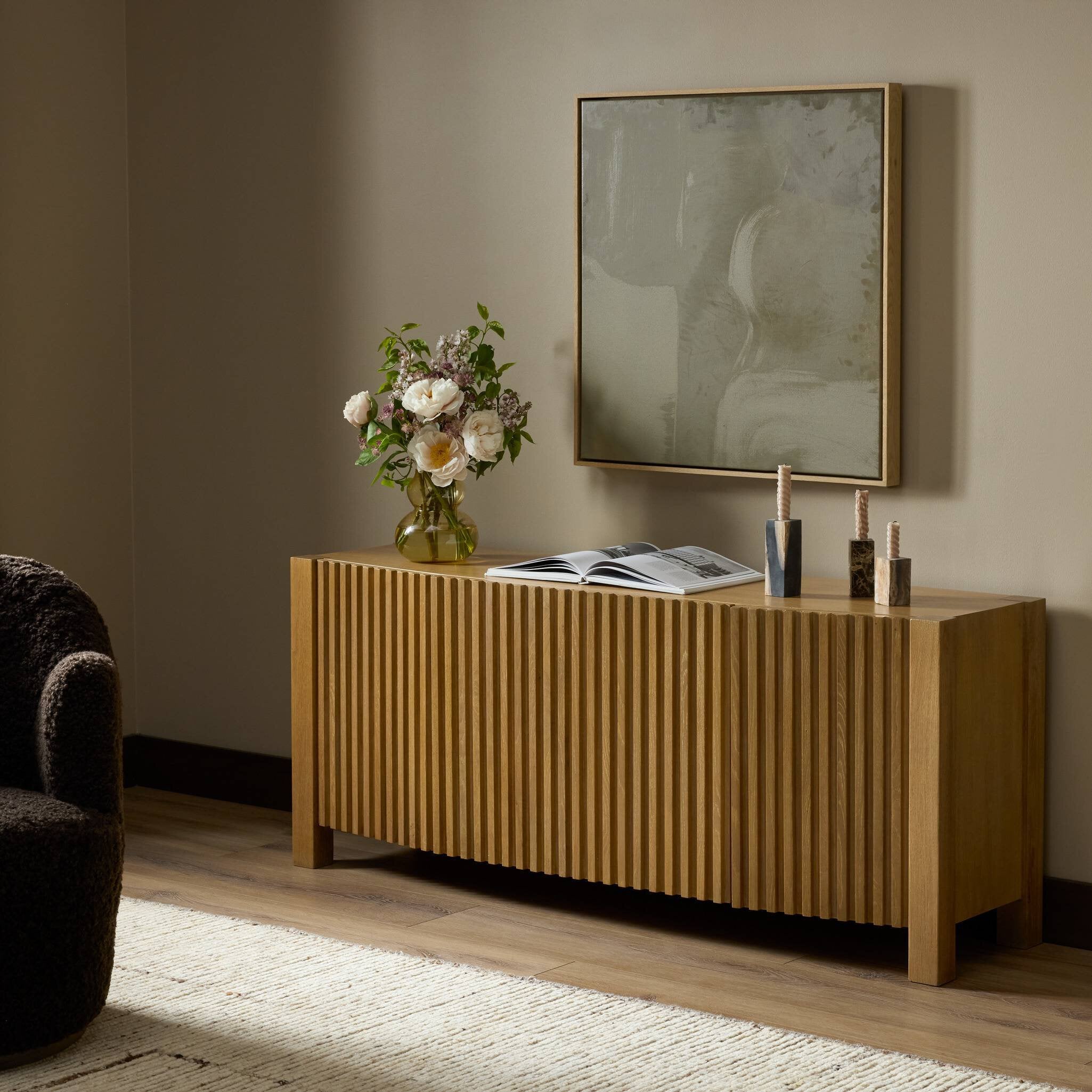 Four Hands Tristan Light Natural Oak Media Console styled in a room setting