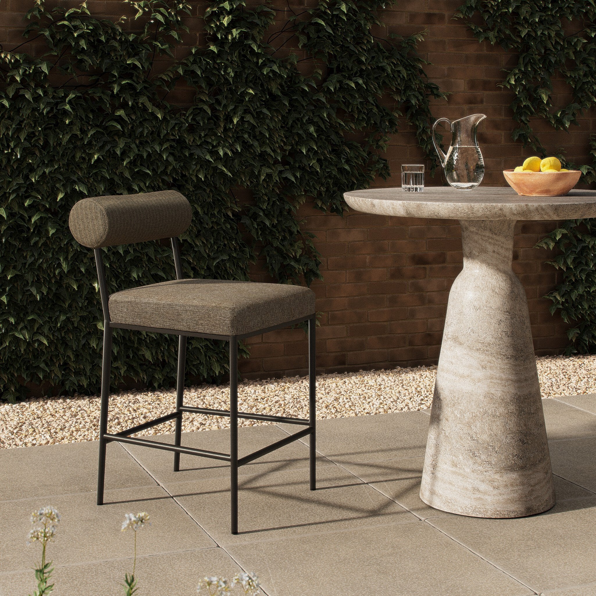 Four Hands Brookline Alessi Fawn Outdoor Counter Stool styled in a room setting
