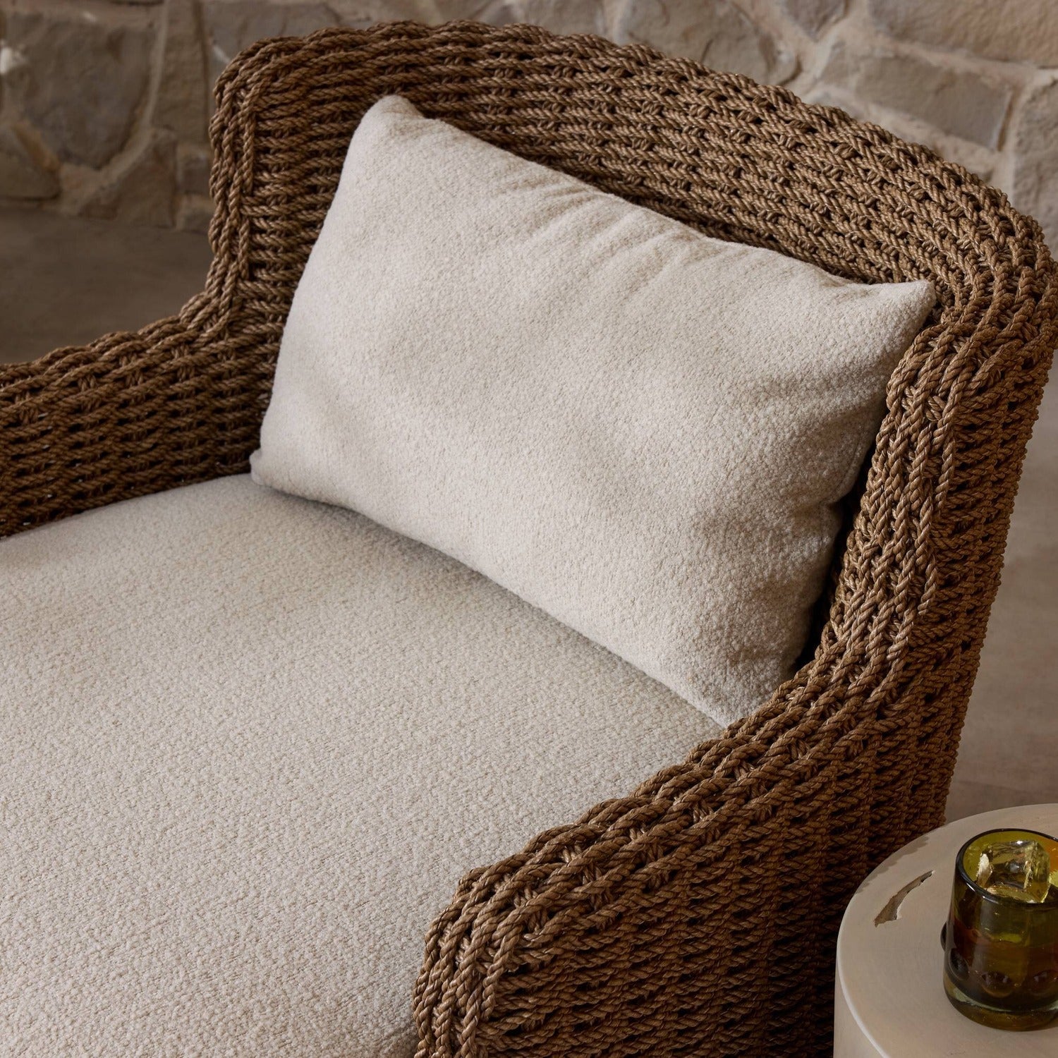 Four Hands Vaughn Vada Cream Outdoor Chair in double-twist woven umber with boucle cushion, alternate styled view