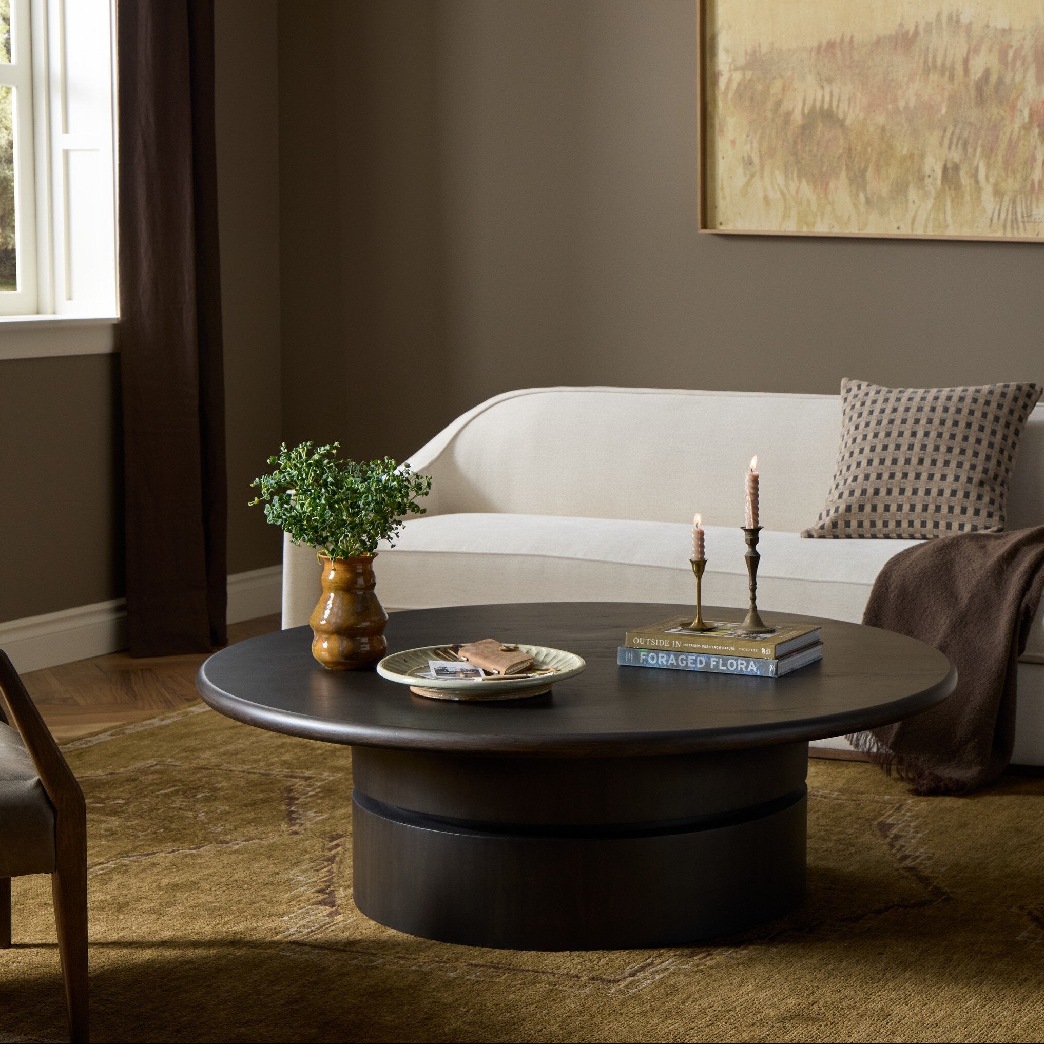 Four Hands Fleur Smoked Black Sungkai Coffee Table — in a styled room setting