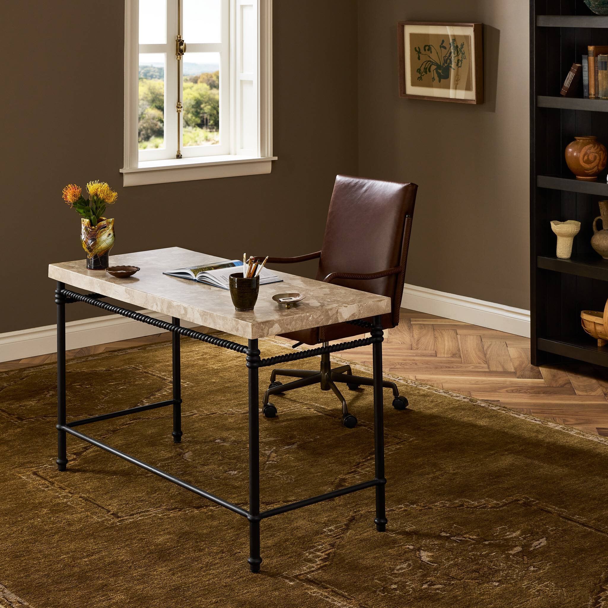 Four Hands Cassia Textured Dark Bronze Desk styled in a room setting