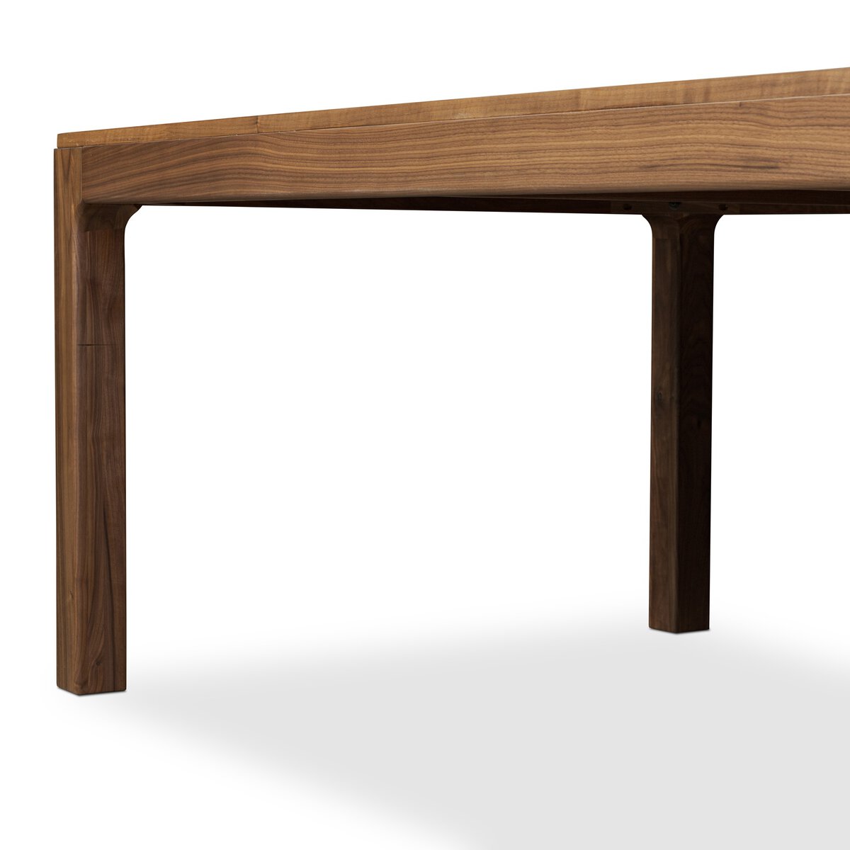 Four Hands Arturo 78in Dining Table in natural walnut, close-up detail of walnut grain, view 1