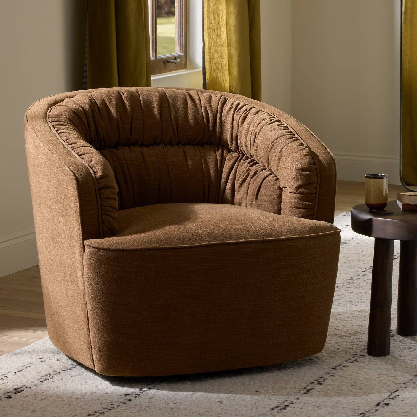 Four Hands Vivienne Laughlin Ochre Swivel Chair - styled room setting