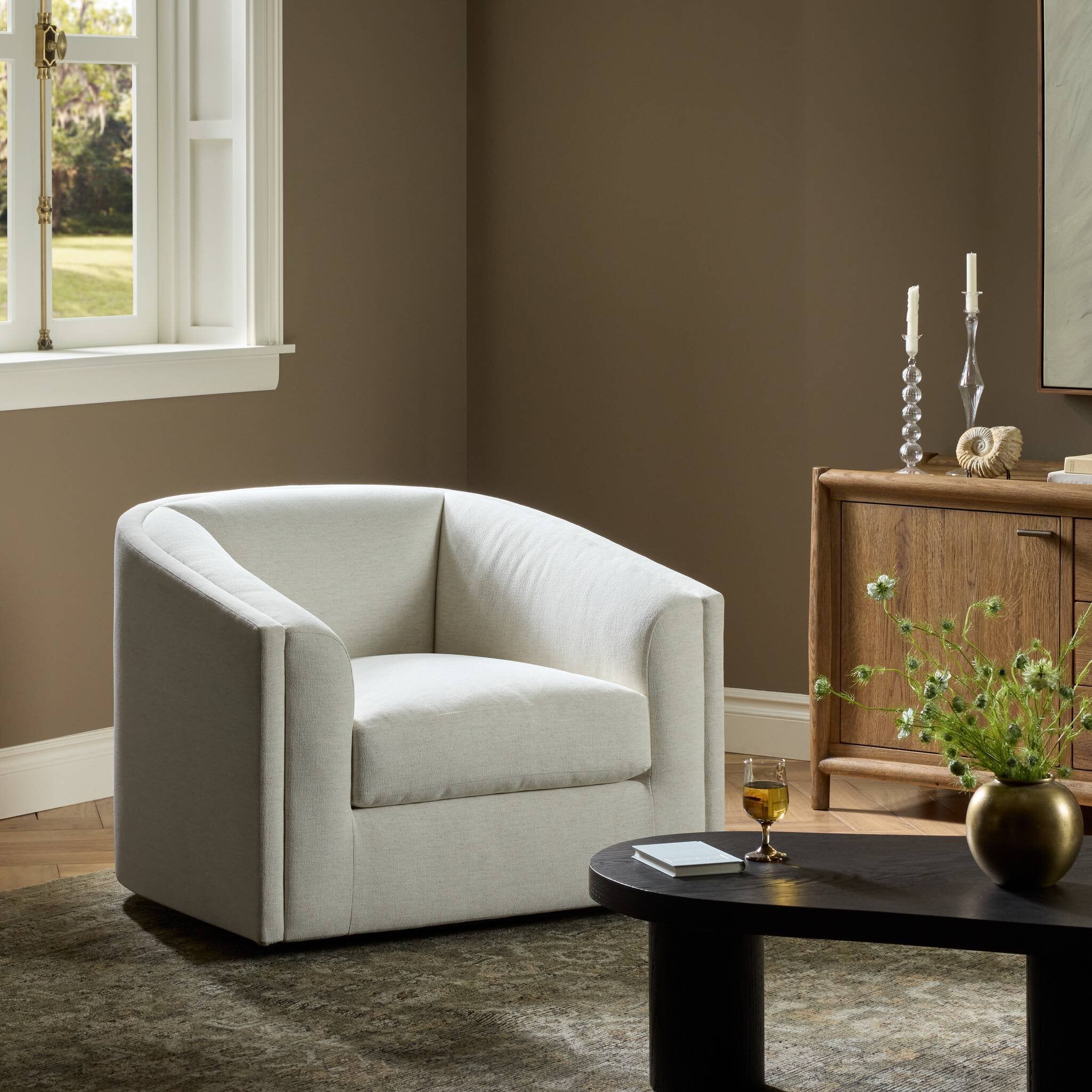Four Hands Presley Crypton Nomad Snow Swivel Chair styled in a room setting