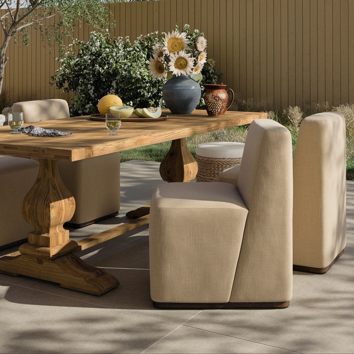 Four Hands Almere Vergo Camel Outdoor Dining Chair styled in a room setting