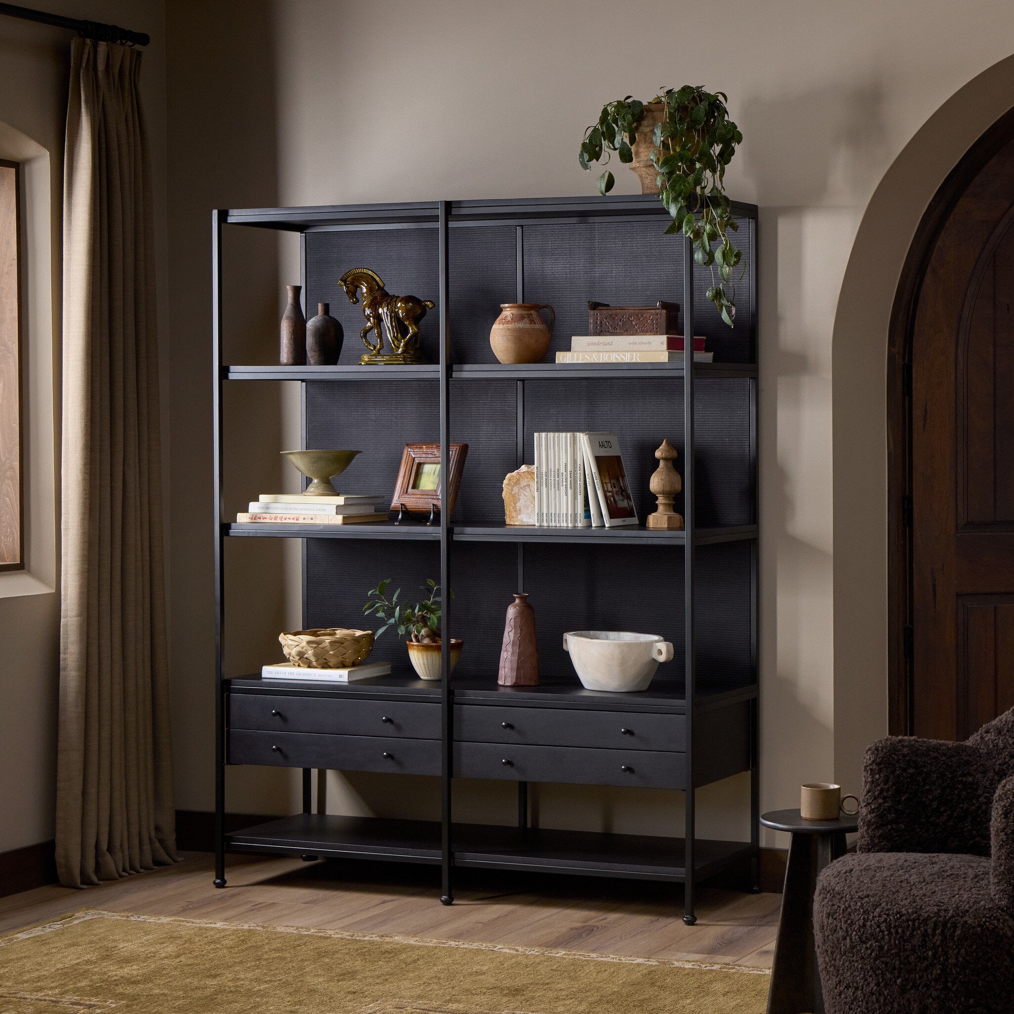 Four Hands Igor Satin Black Bookcase styled room setting