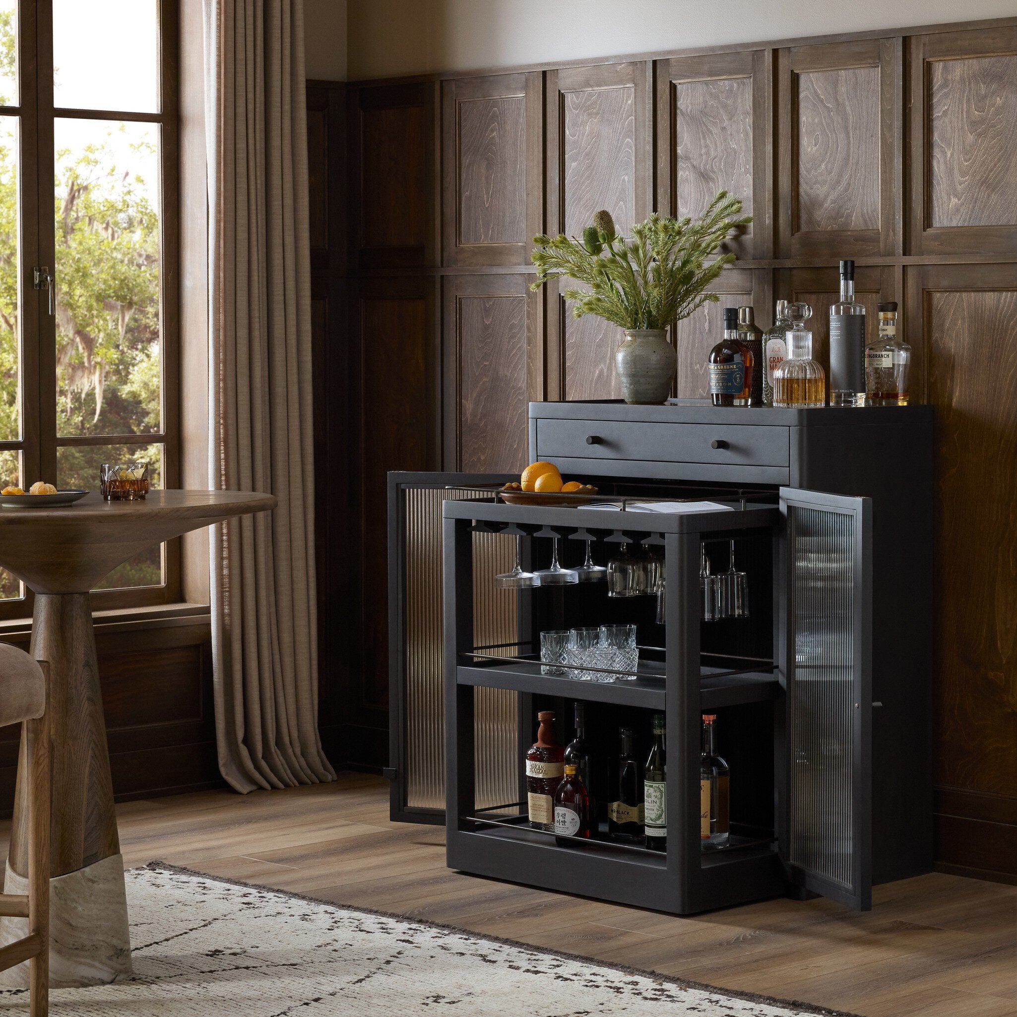Four Hands Santiago Smoked Black Mango Bar Cabinet styled room setting