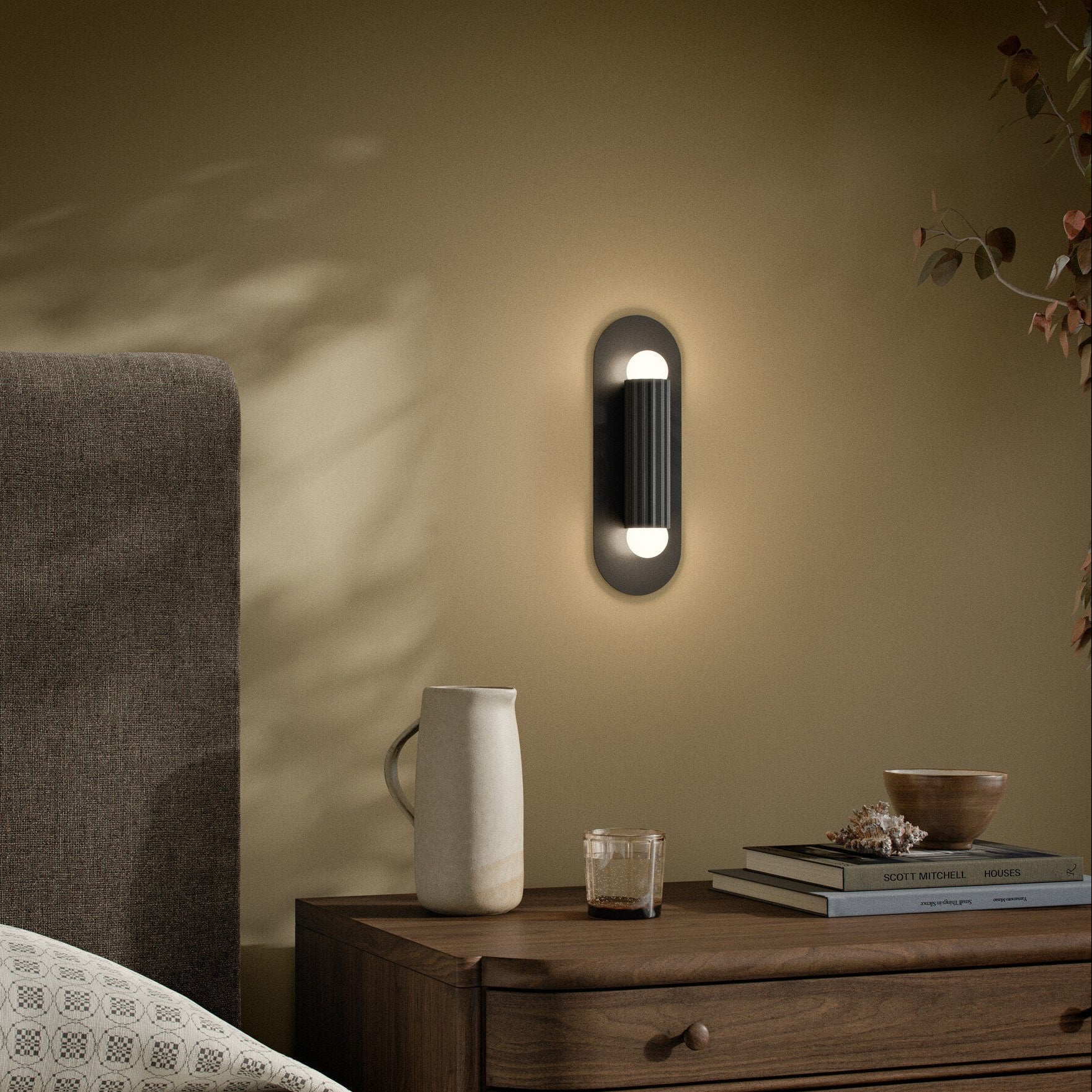 Four Hands Vesta Black Gunmetal Wall Sconce styled room setting