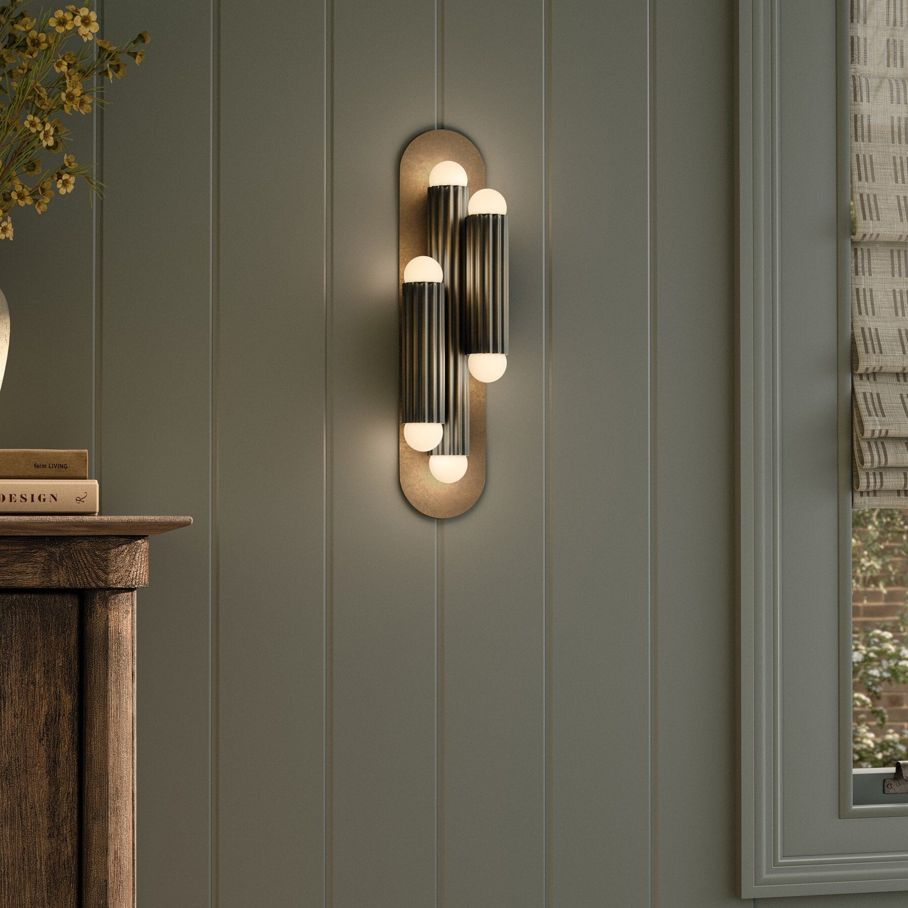 Four Hands Vesta Heritage Bronze Brass Triple Wall Sconce styled in a room setting