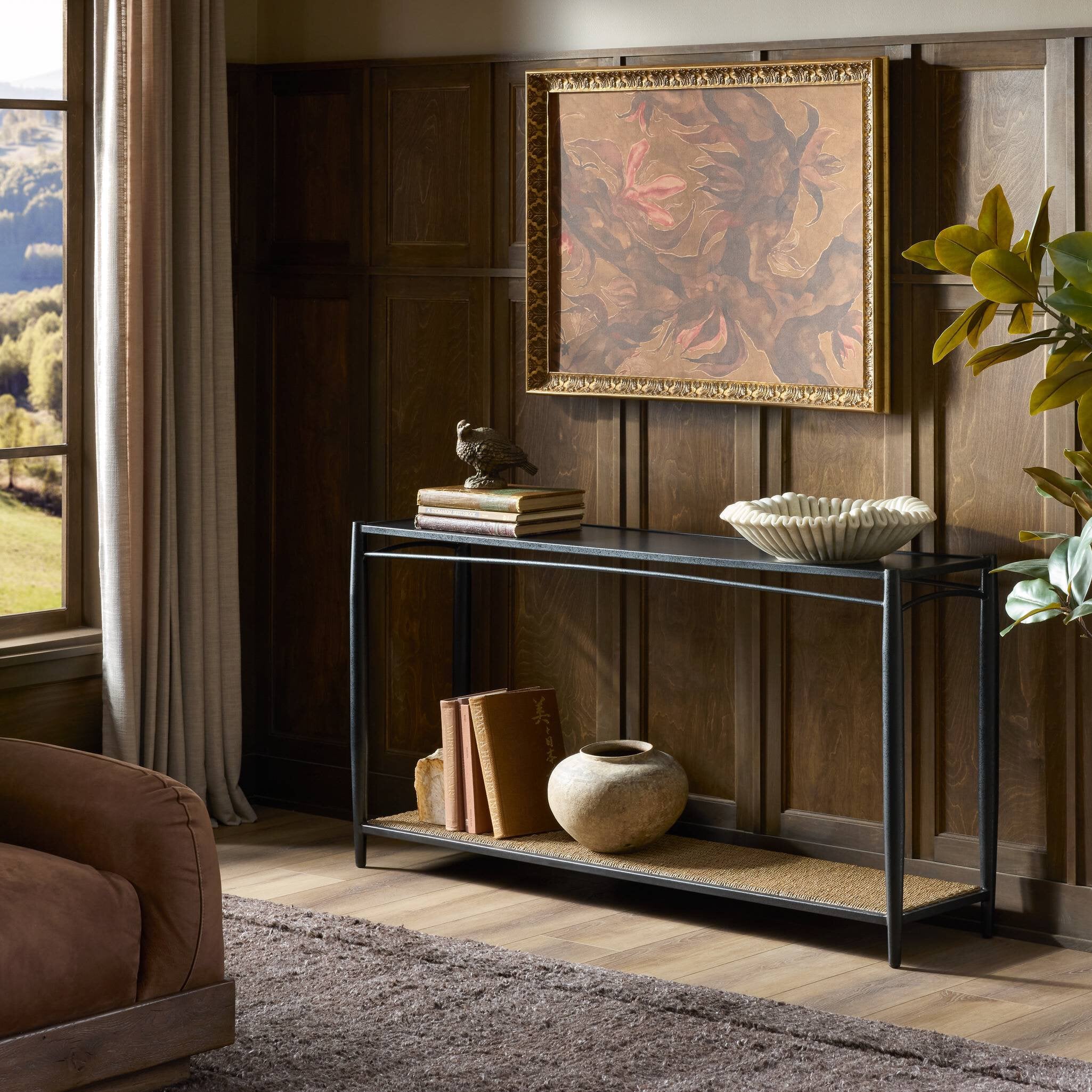 Four Hands Thalen Rough Iron Console Table styled in a room setting