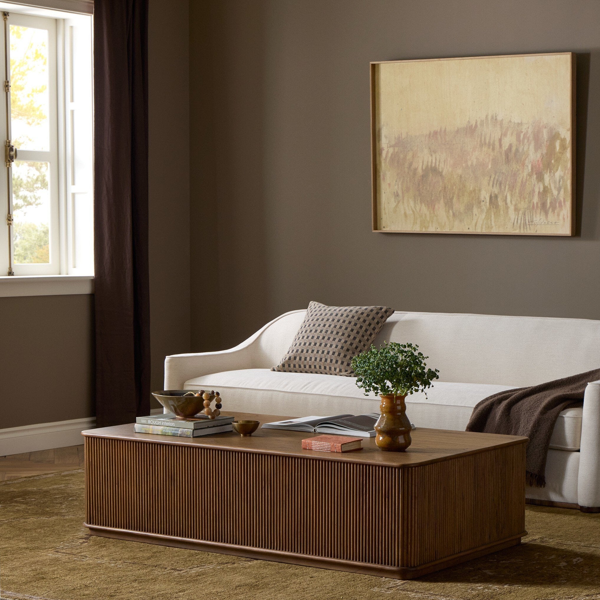Four Hands Ona Amber Mindi Rectangular Coffee Table styled in a room setting
