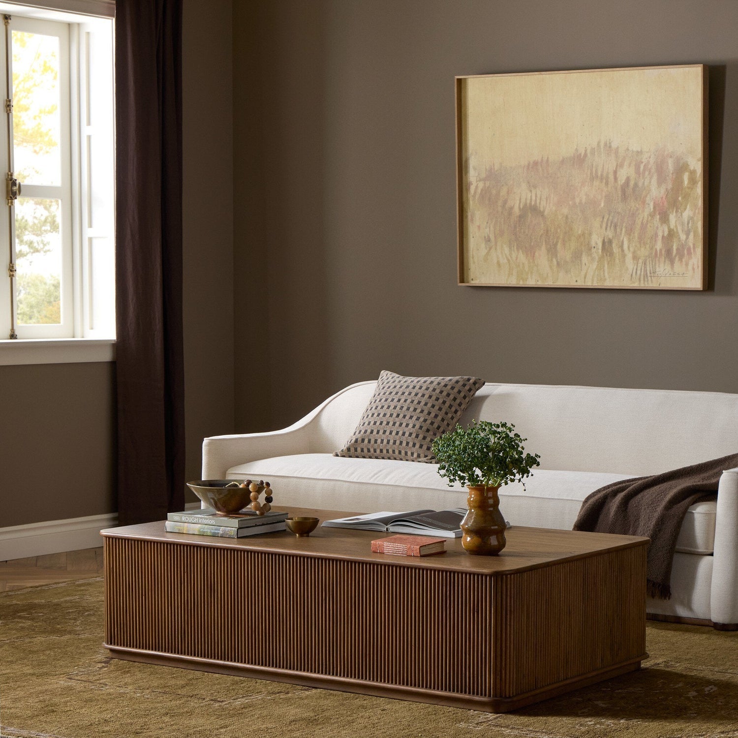 Four Hands Ona Amber Mindi Rectangular Coffee Table styled in a room setting