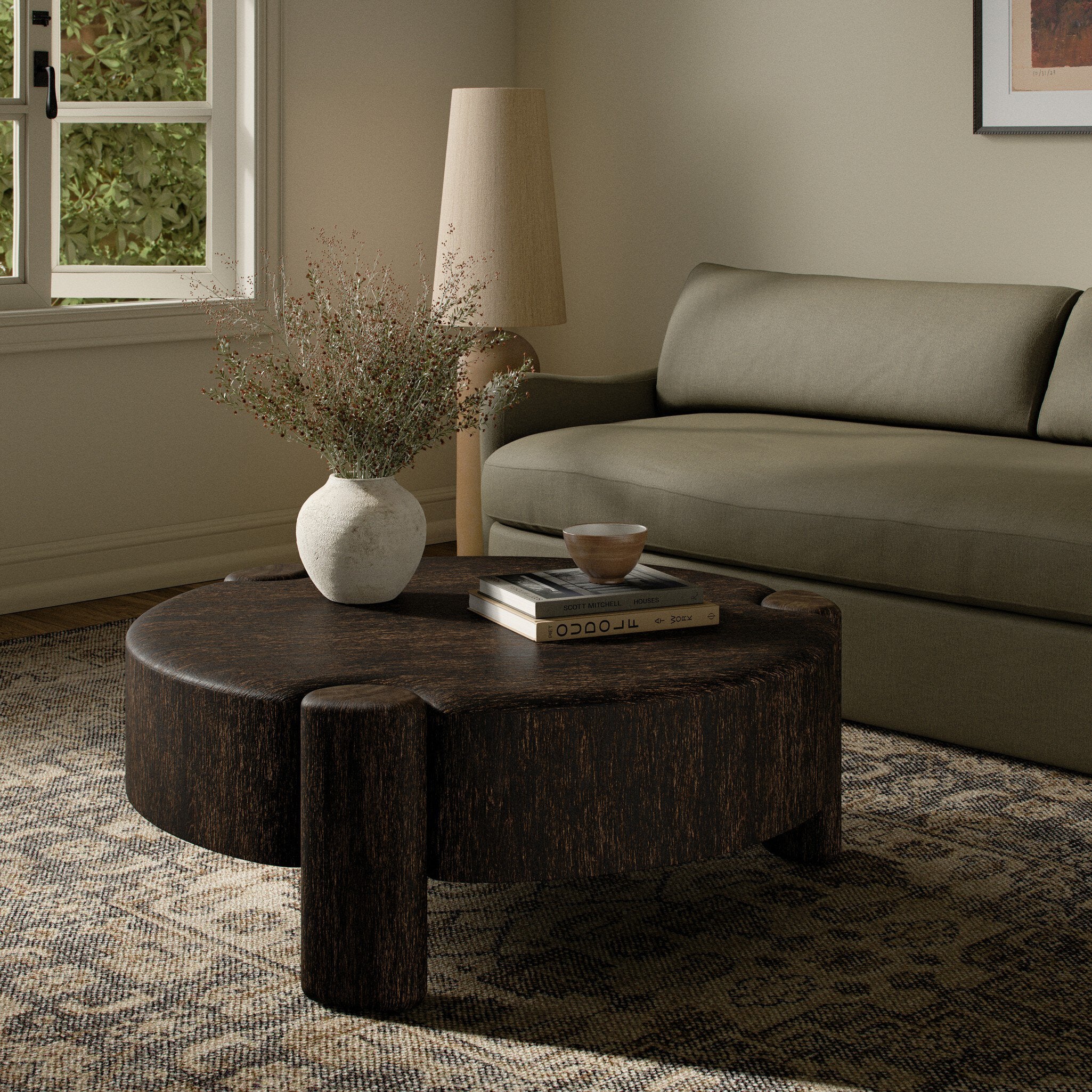 Four Hands Toman Ebony Rustic Oak Coffee Table styled in a room setting
