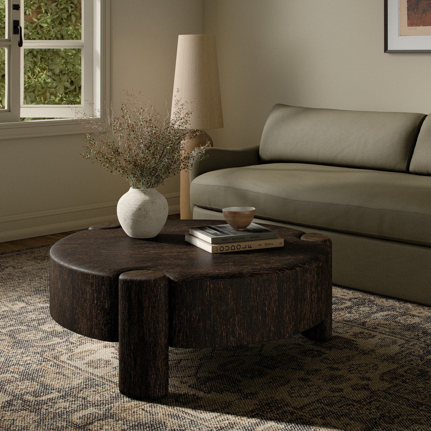 Four Hands Toman Ebony Rustic Oak Coffee Table styled in a room setting