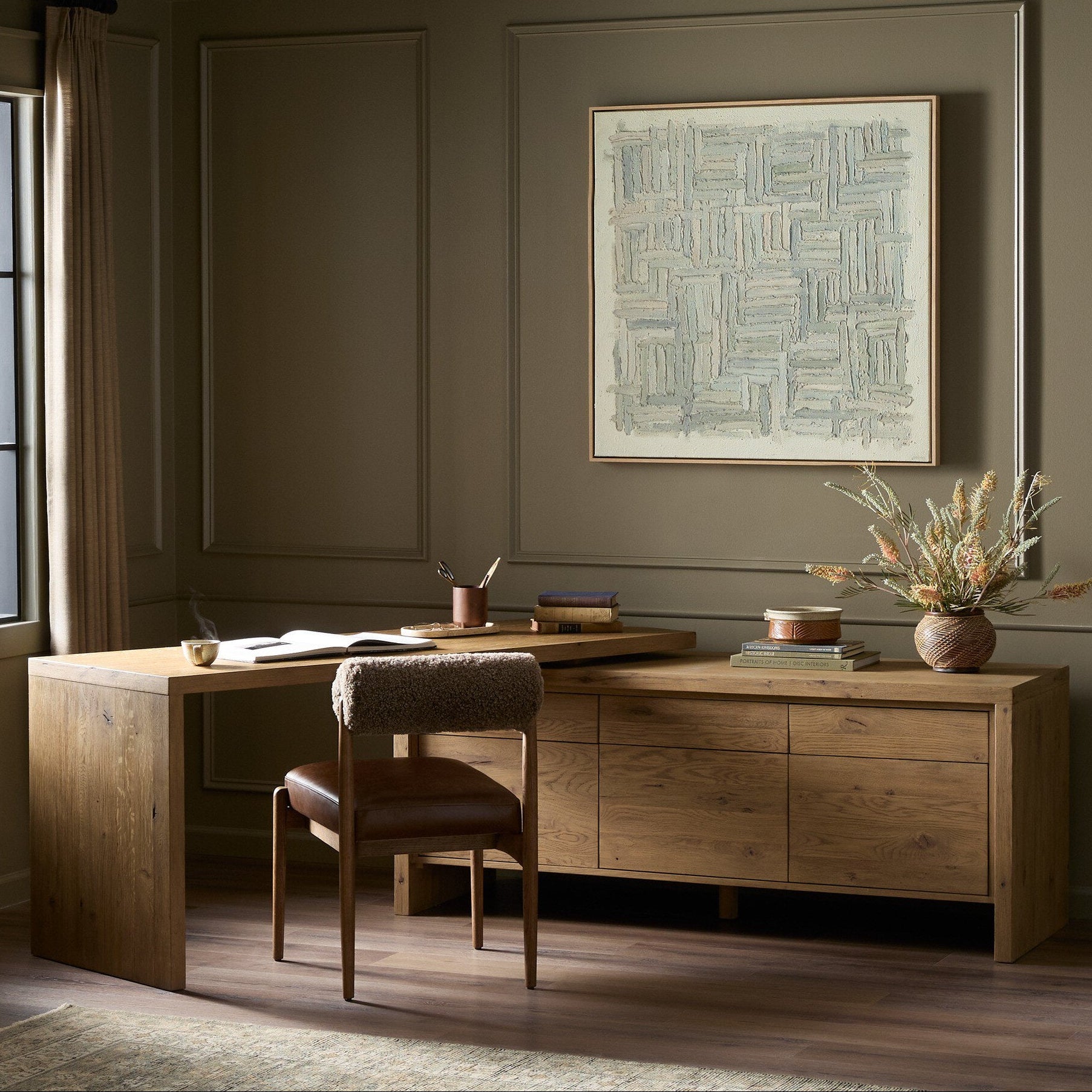 Four Hands Noah Aged Smoked Oak Resawn Rotating Desk - styled room setting