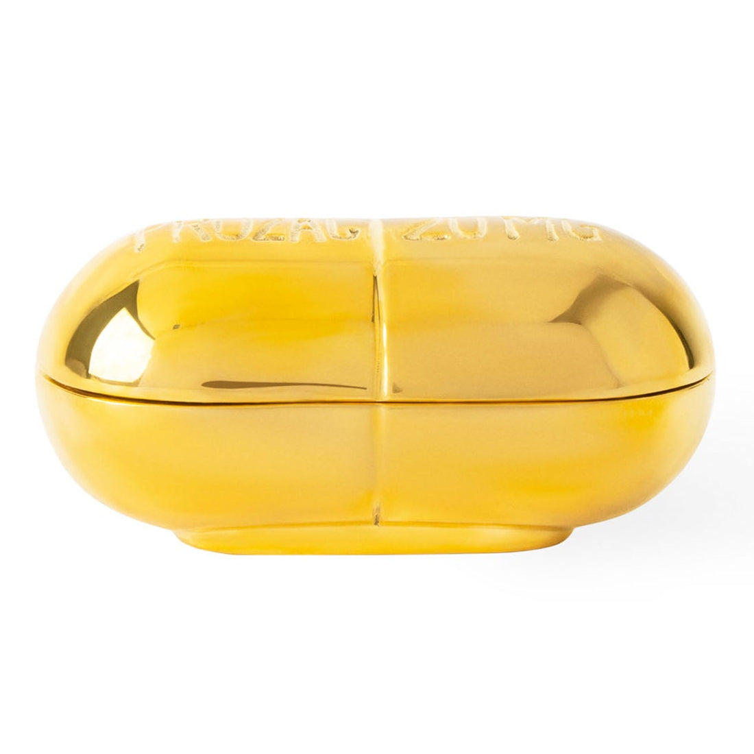 Jonathan Adler Brass Prozac Pill Box in solid polished brass styled in a room