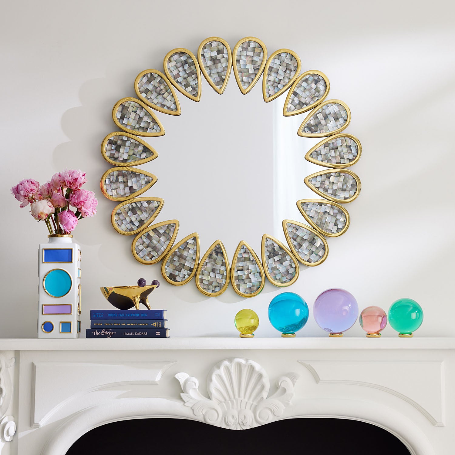 Jonathan Adler Acrylic Orb Set of five jewel-tone acrylic orbs on brass stands styled in a room