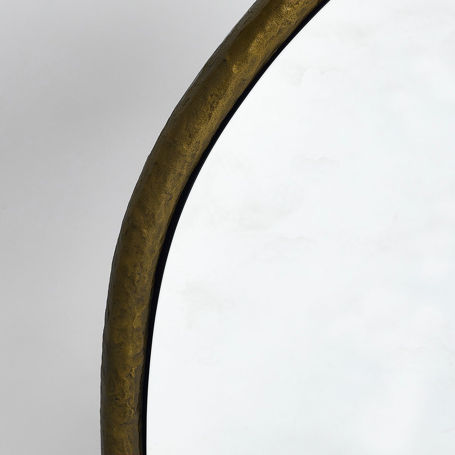 Detail of the frame on the Interlude Home Andover Golden Bronze Organic Mirror