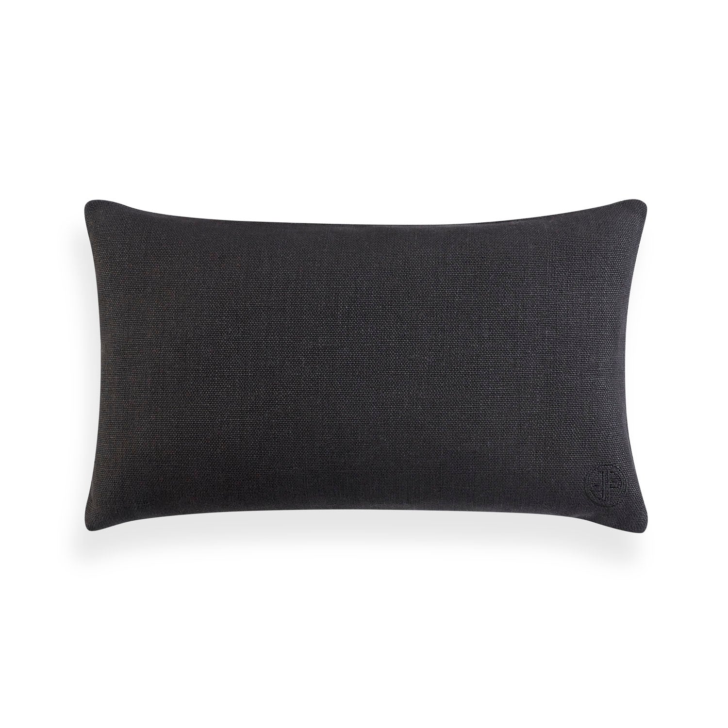 Toklas neutral rectangle pillow shown to scale on a chair