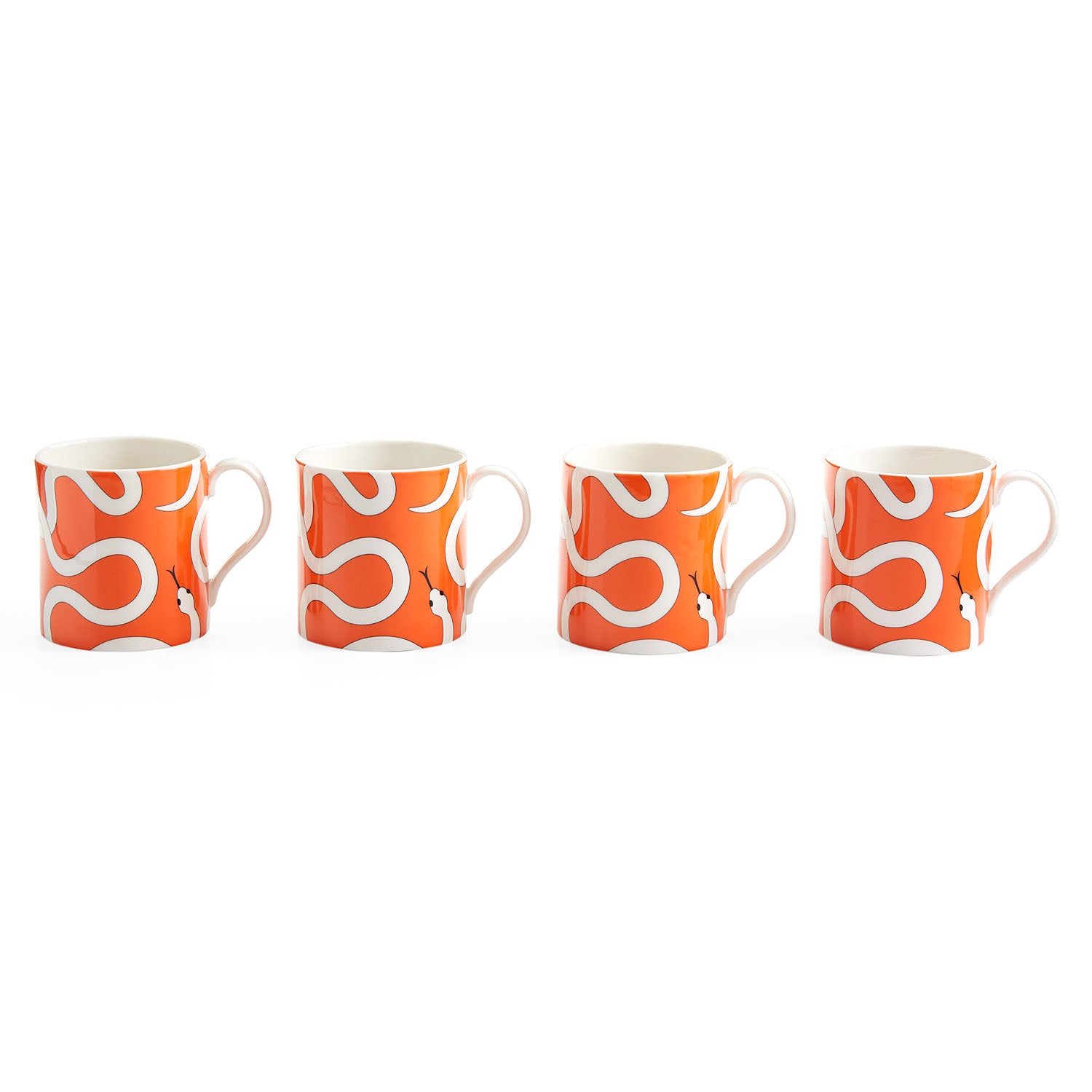 Jonathan Adler Eden Mug Set of 4 in glossy poppy orange porcelain styled in a room