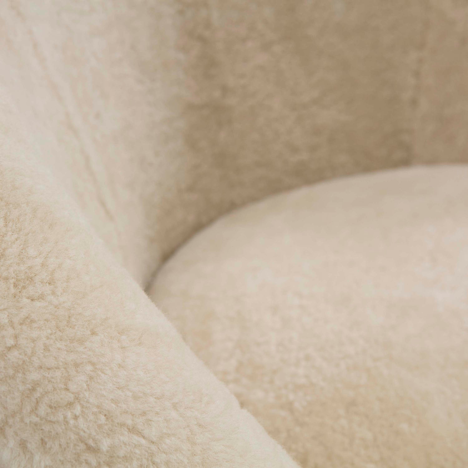 Overhead view of Jonathan Adler Ether Curly Sheepskin Swivel Chair on a brass base