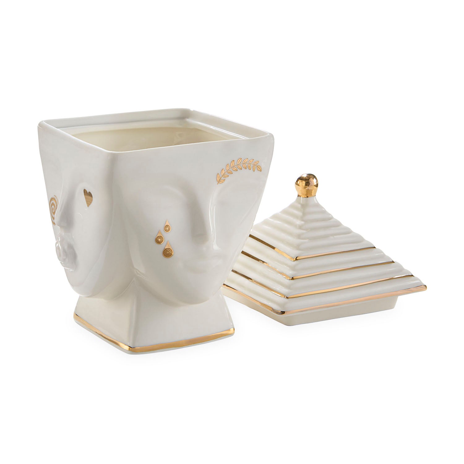 Jonathan Adler Muse Masquerade candle styled on a shelf