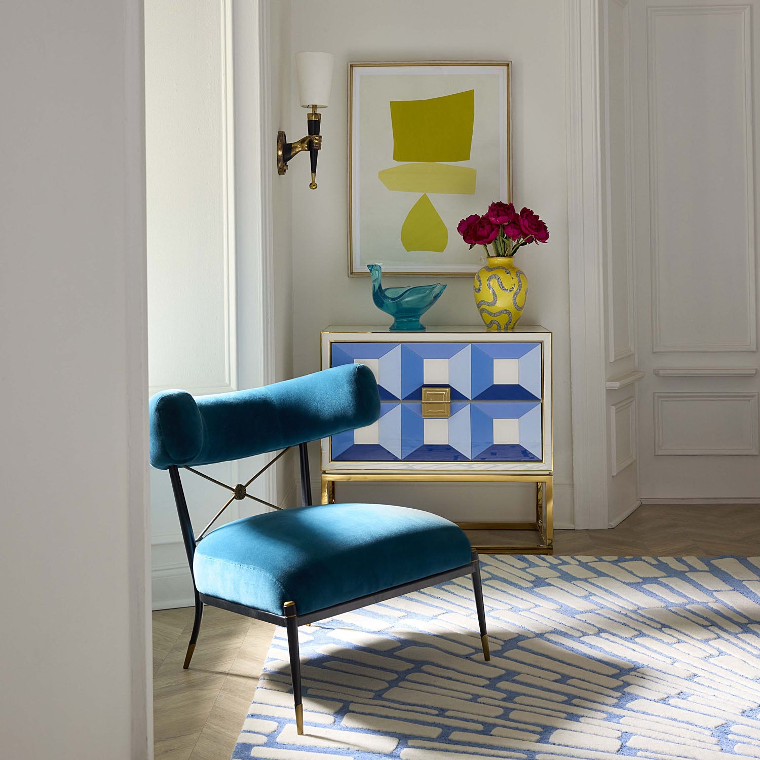Jonathan Adler Side view of the Sorrento two-drawer console in blue back-painted glass with brass