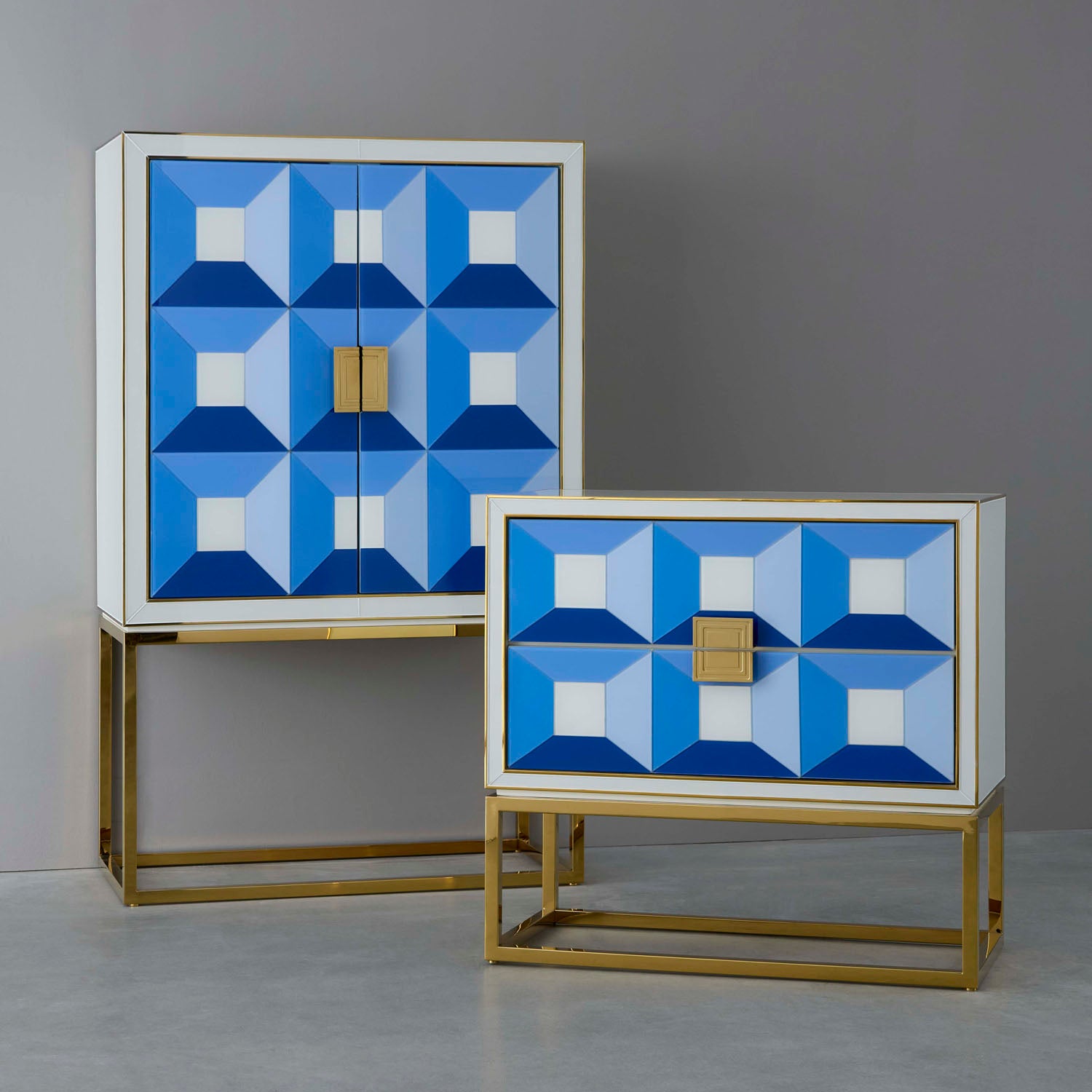 Jonathan Adler The Sorrento two-drawer console in blue back-painted glass with brass styled in a room