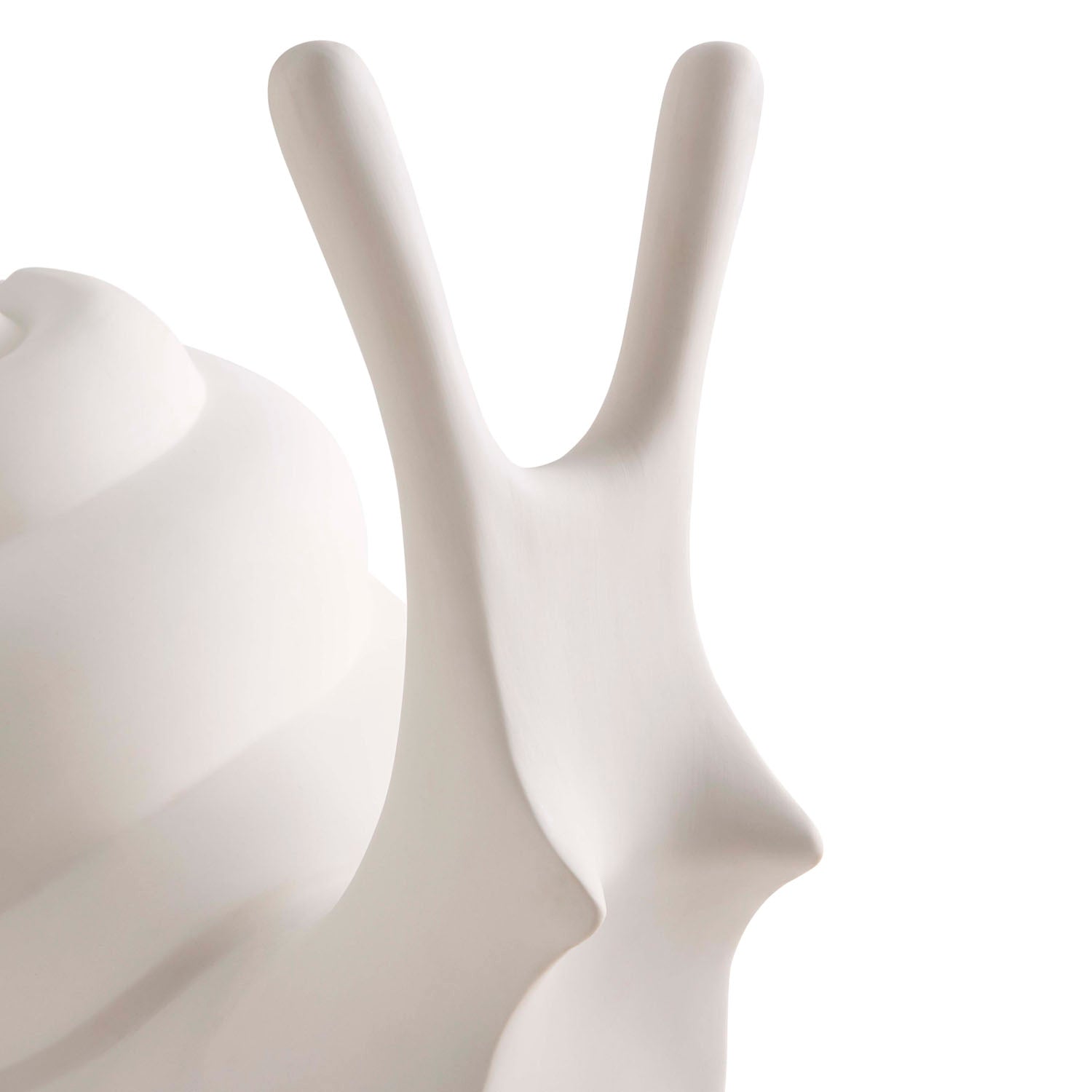Jonathan Adler Giant Snail lamp styled in a bedroom