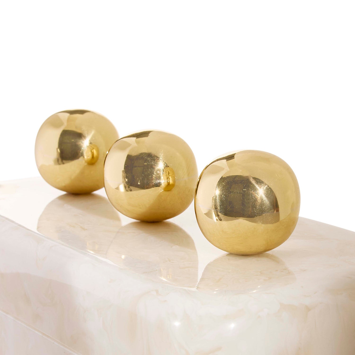 Side profile of Jonathan Adler Fontana Box in white marbleized acrylic with brass handles