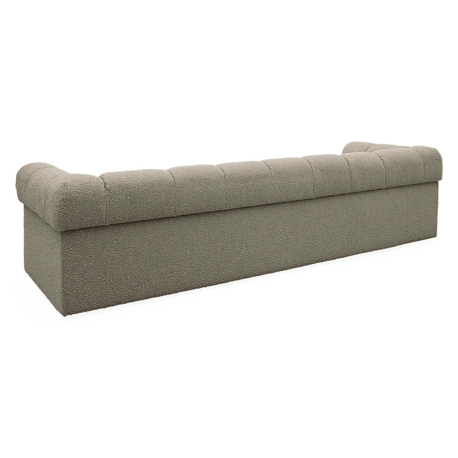 Jonathan Adler Side view of the Soho sofa in warm grey boucle with tailored Chesterfield tufting