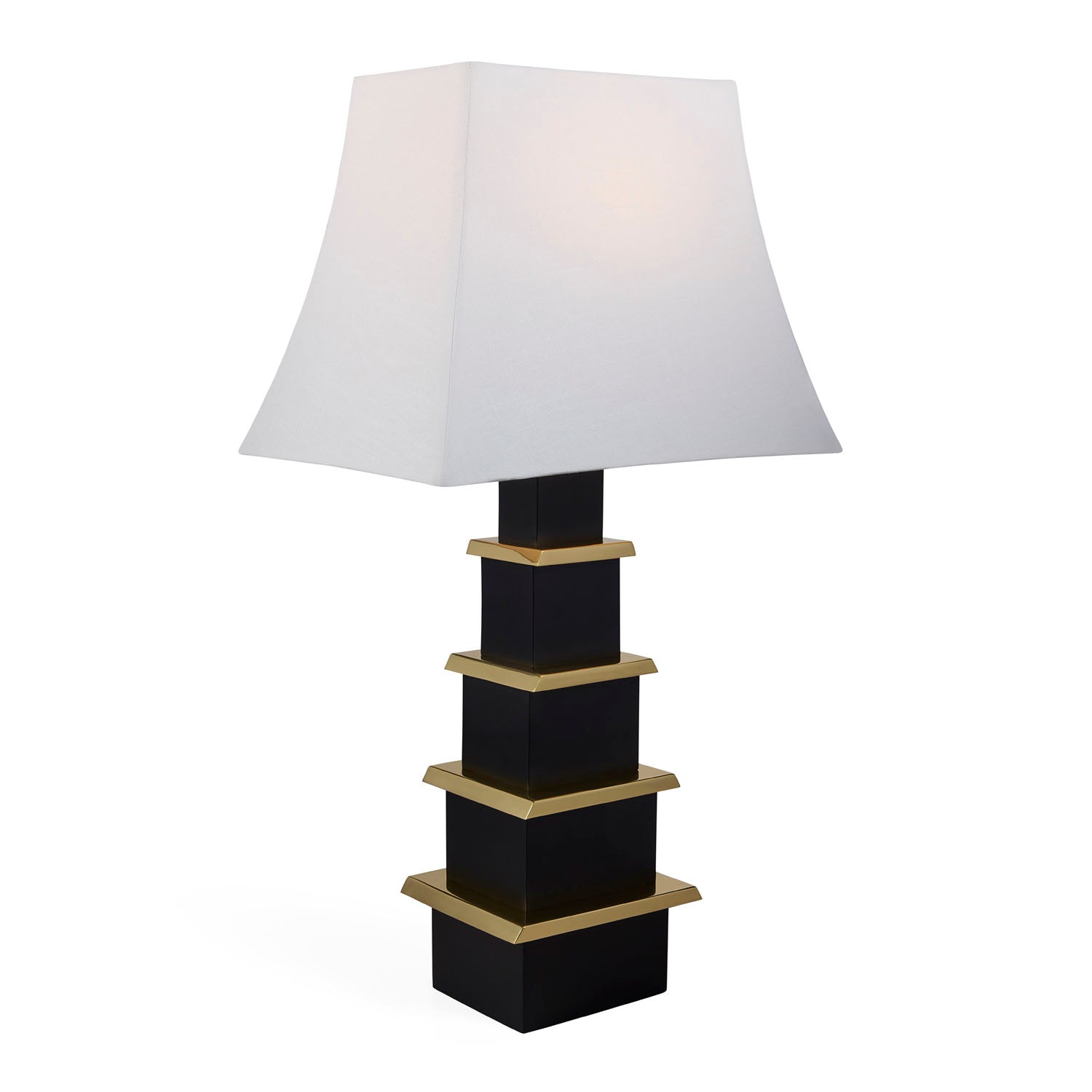 Jonathan Adler Pagoda black lamp illuminated on a console