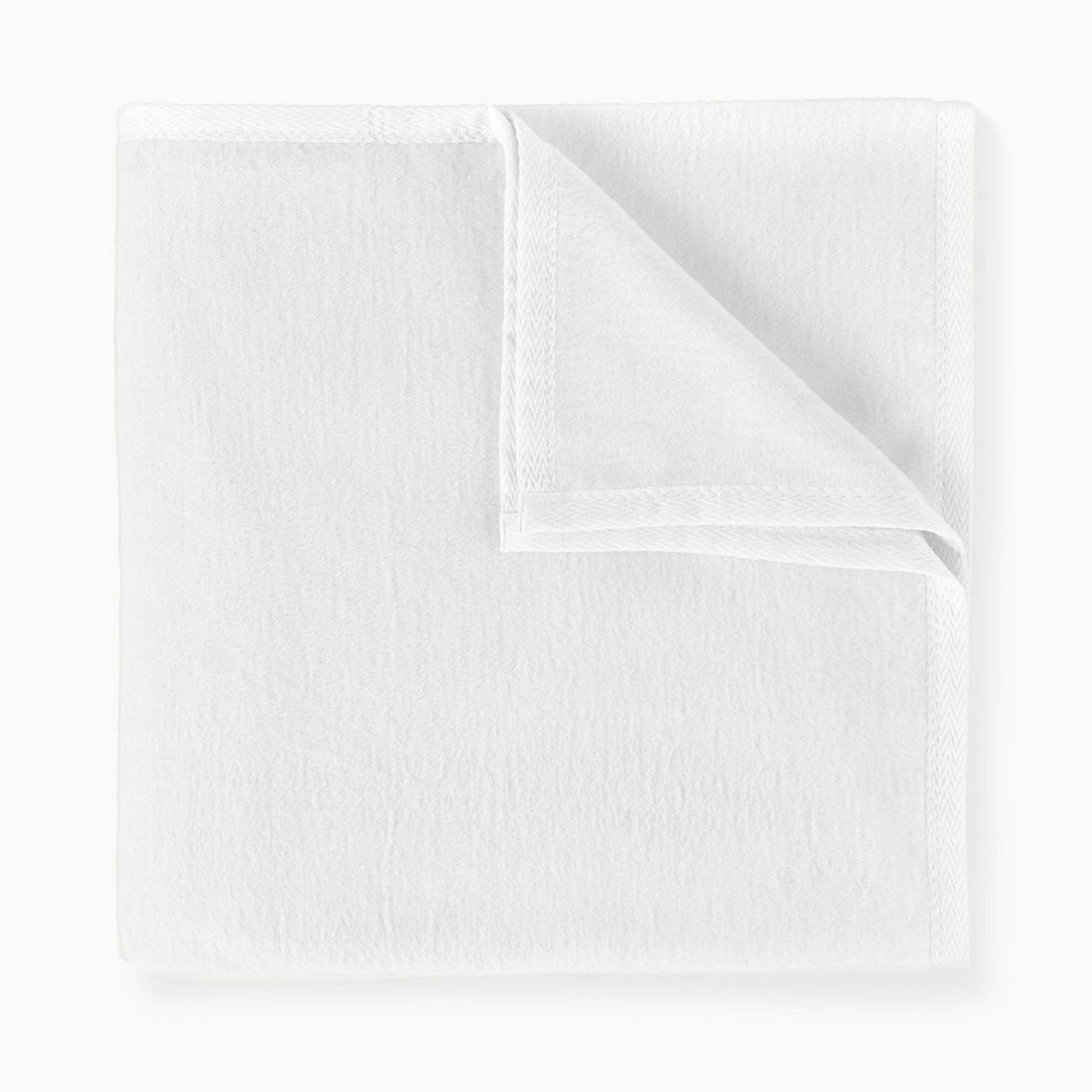 Peacock Alley All Seasons cotton throw blanket stack of neatly folded linens