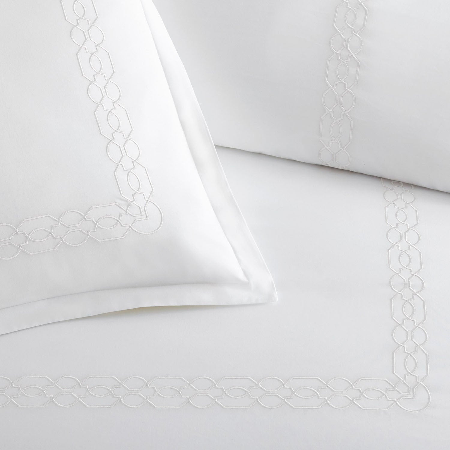 Peacock Alley Filigree embroidered cotton percale duvet set styled in a bright bedroom