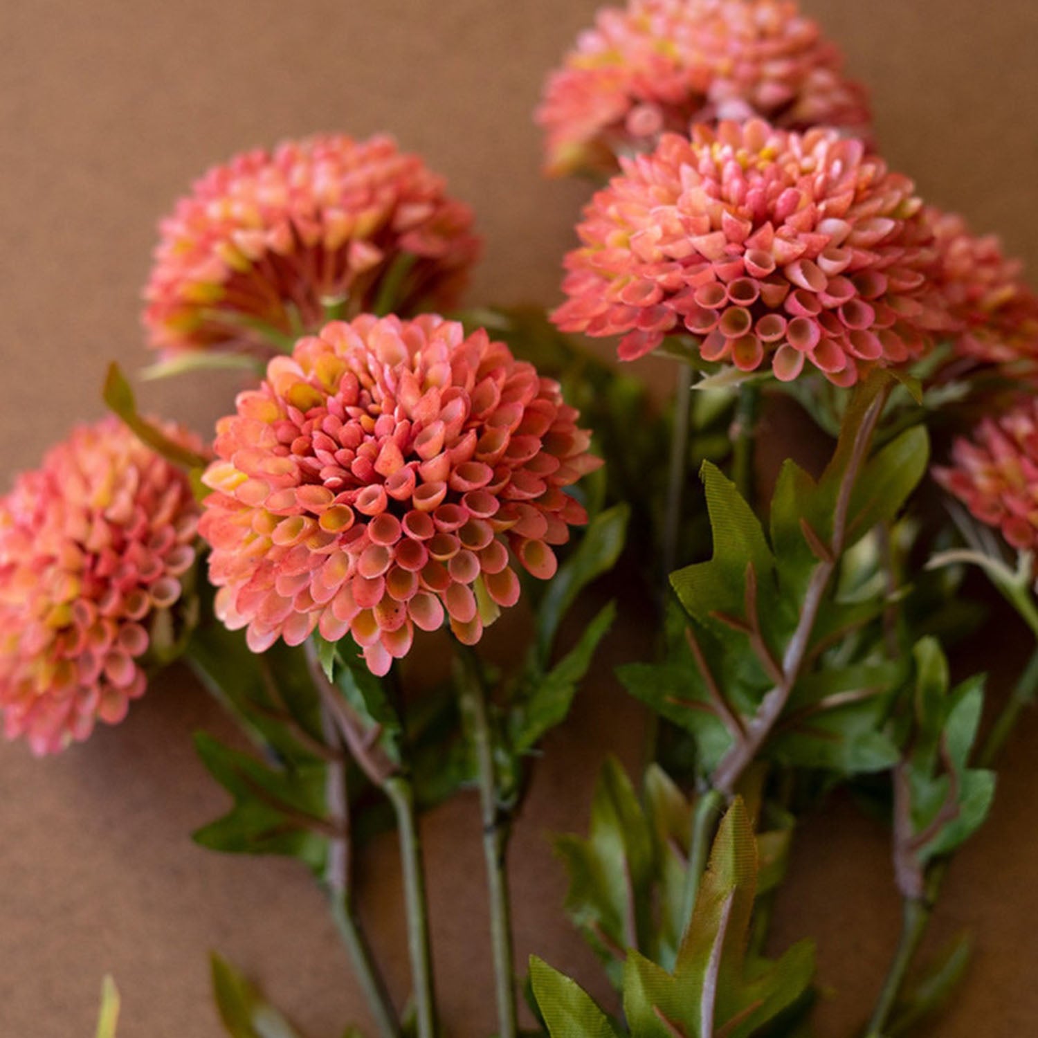 Artificial ball dahlias styled on a tabletop