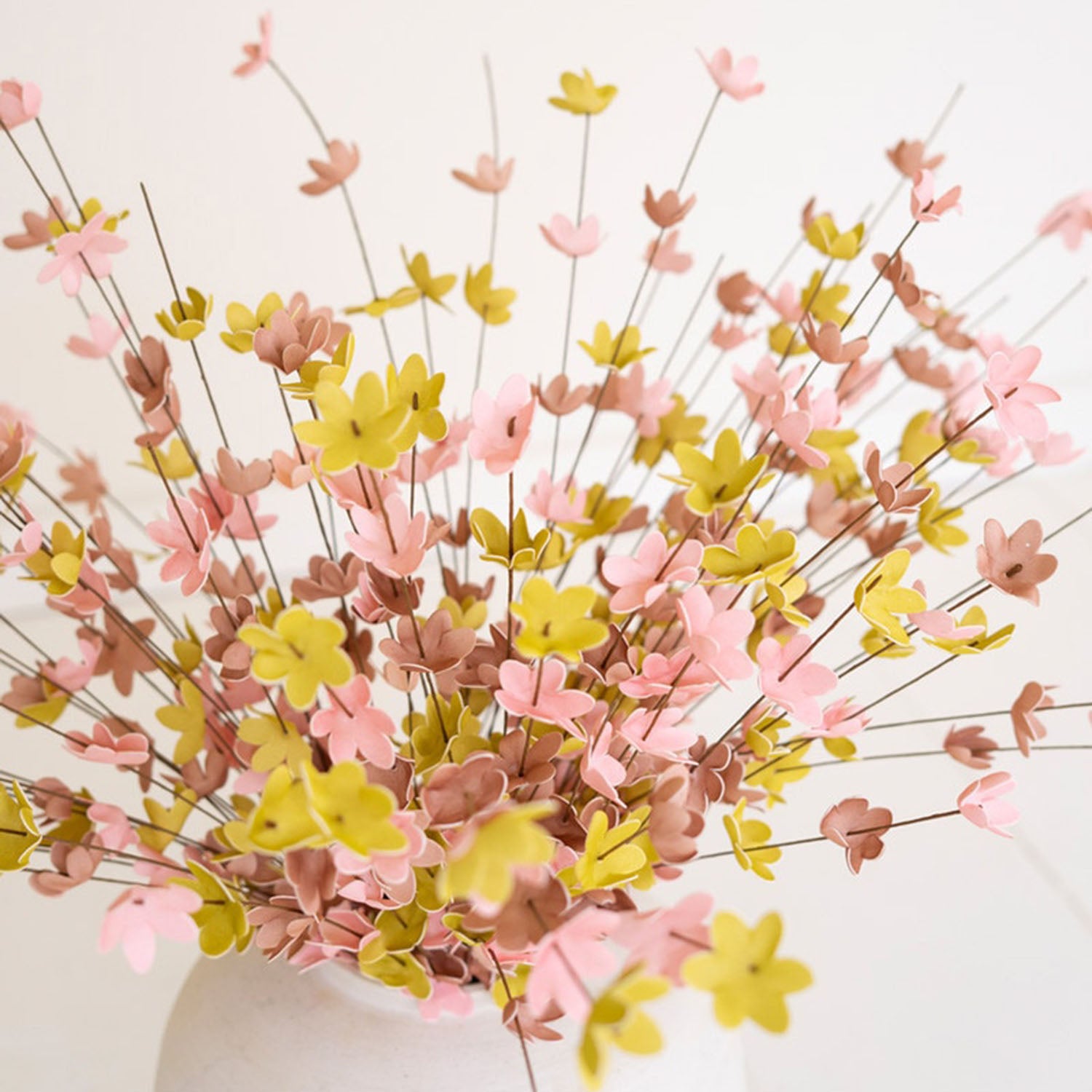 Close-up of the berry clusters and tinted leaves on the Botanica #9012 faux stem